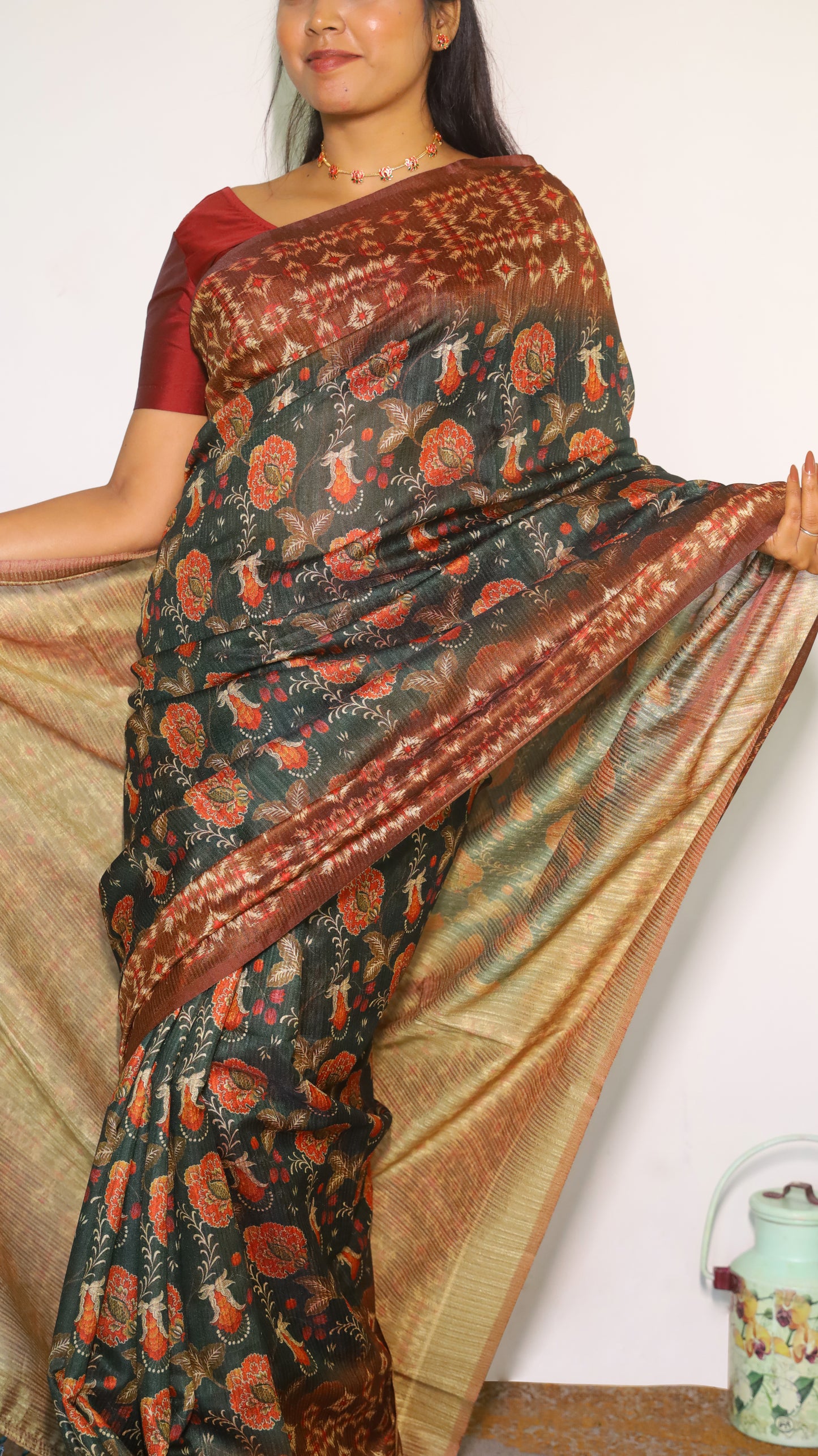Elegant deep forest green body decorated with rust red and gold floral motifs