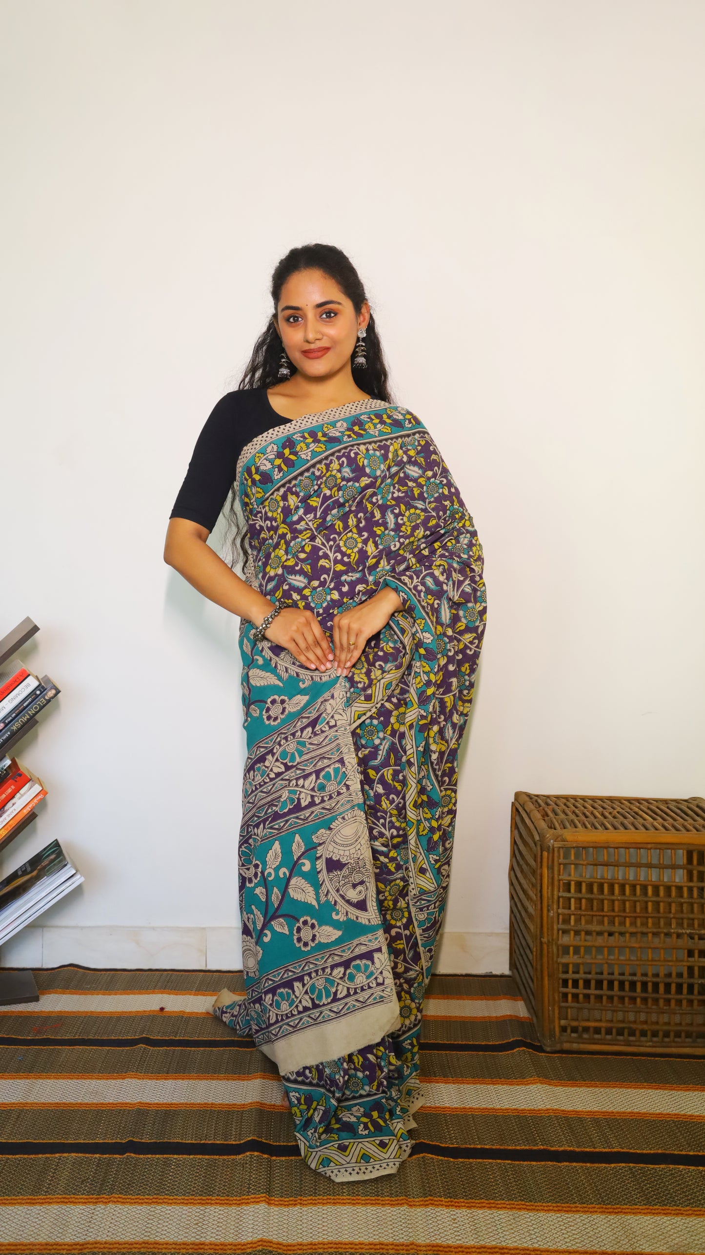 Breathable purple cotton kalamkari saree featuring floral buttas and geometric border - BOOMIKA