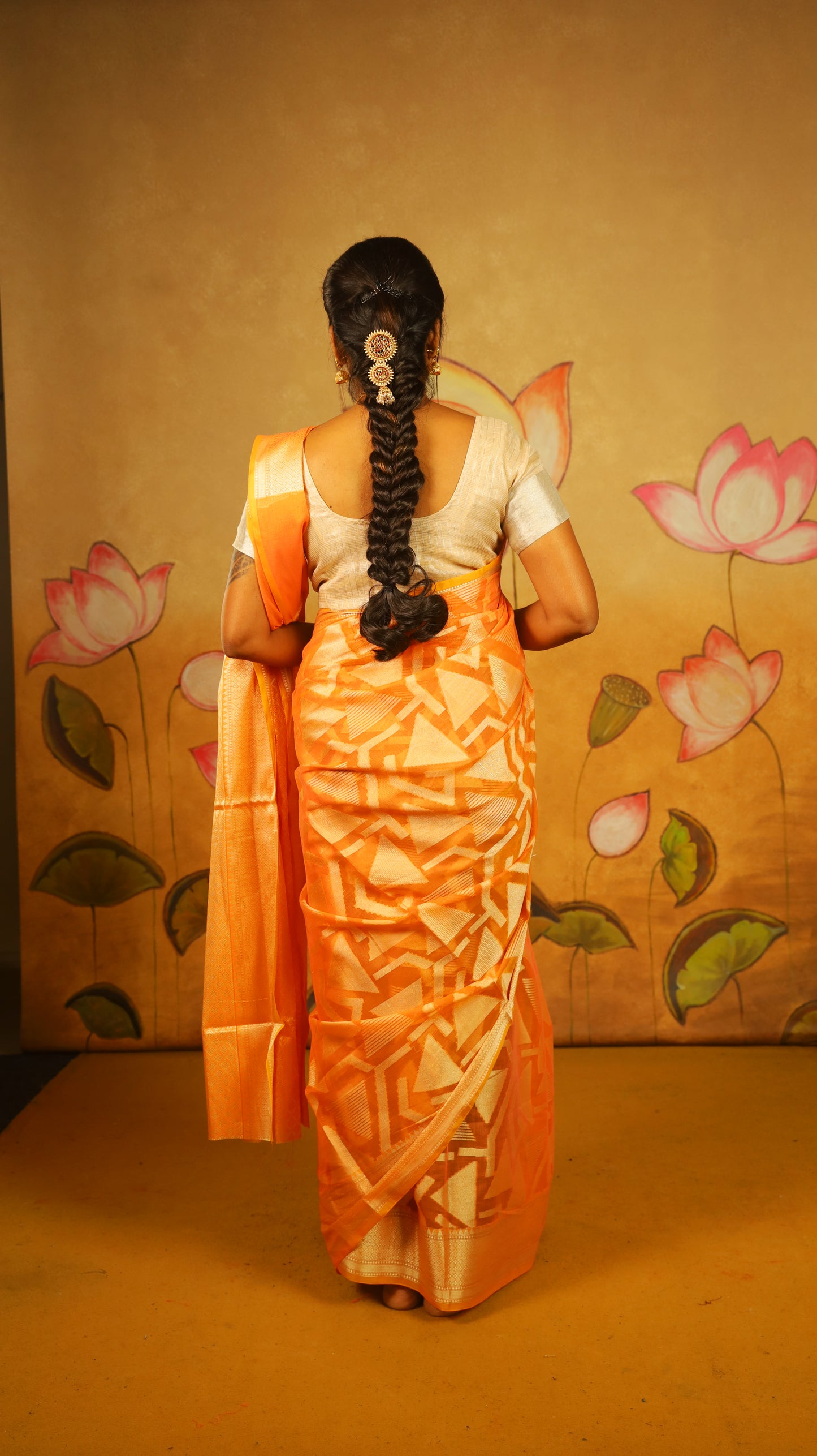 Luxurious Manipuri cotton saree in bright orange and brocade design with gold zari border - BOOMIKA