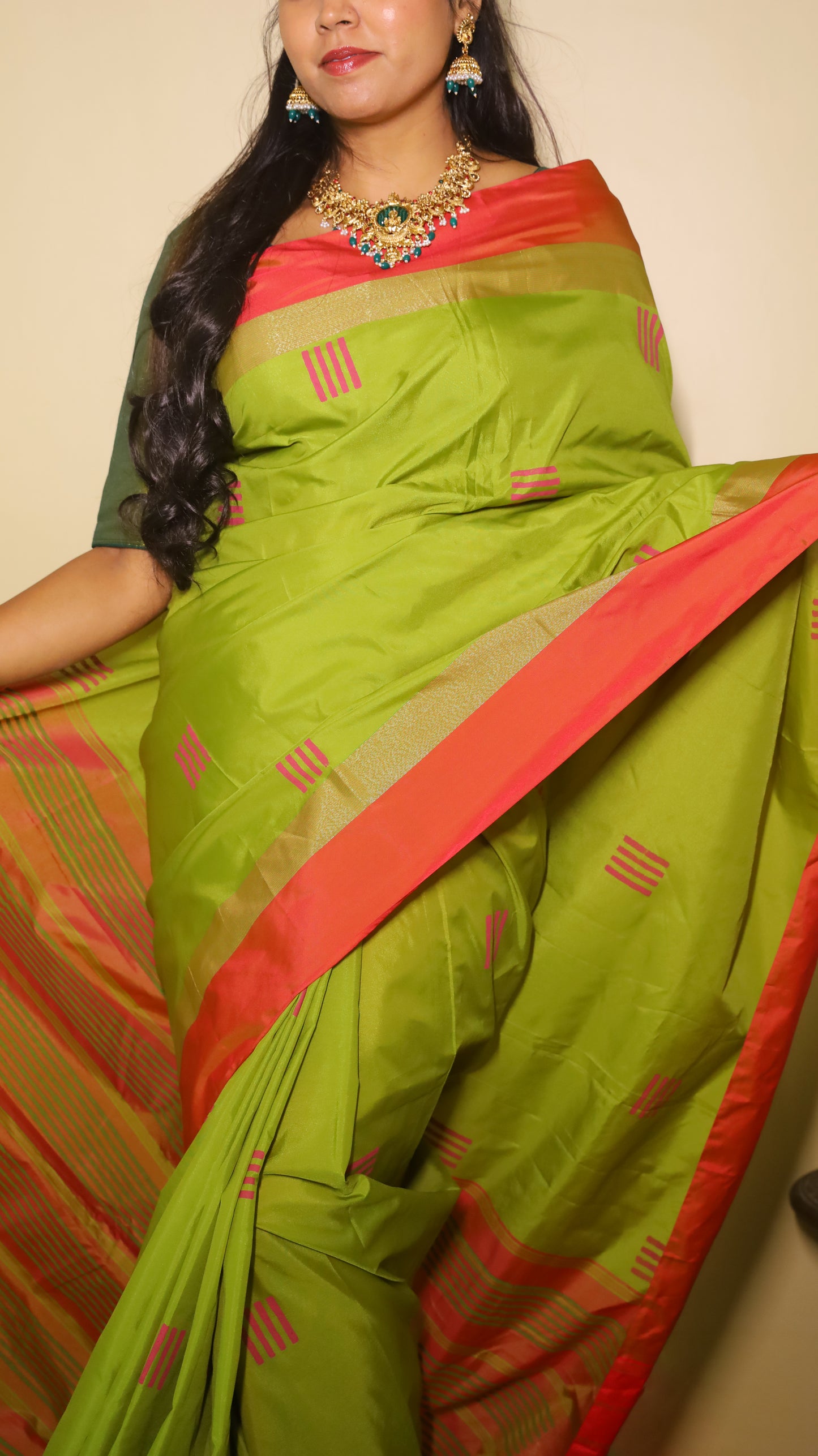 Elegant light green Pasmina silk saree adorned with delicate pink woven motifs, and contrasting pink-gold border - AVANTHIKA