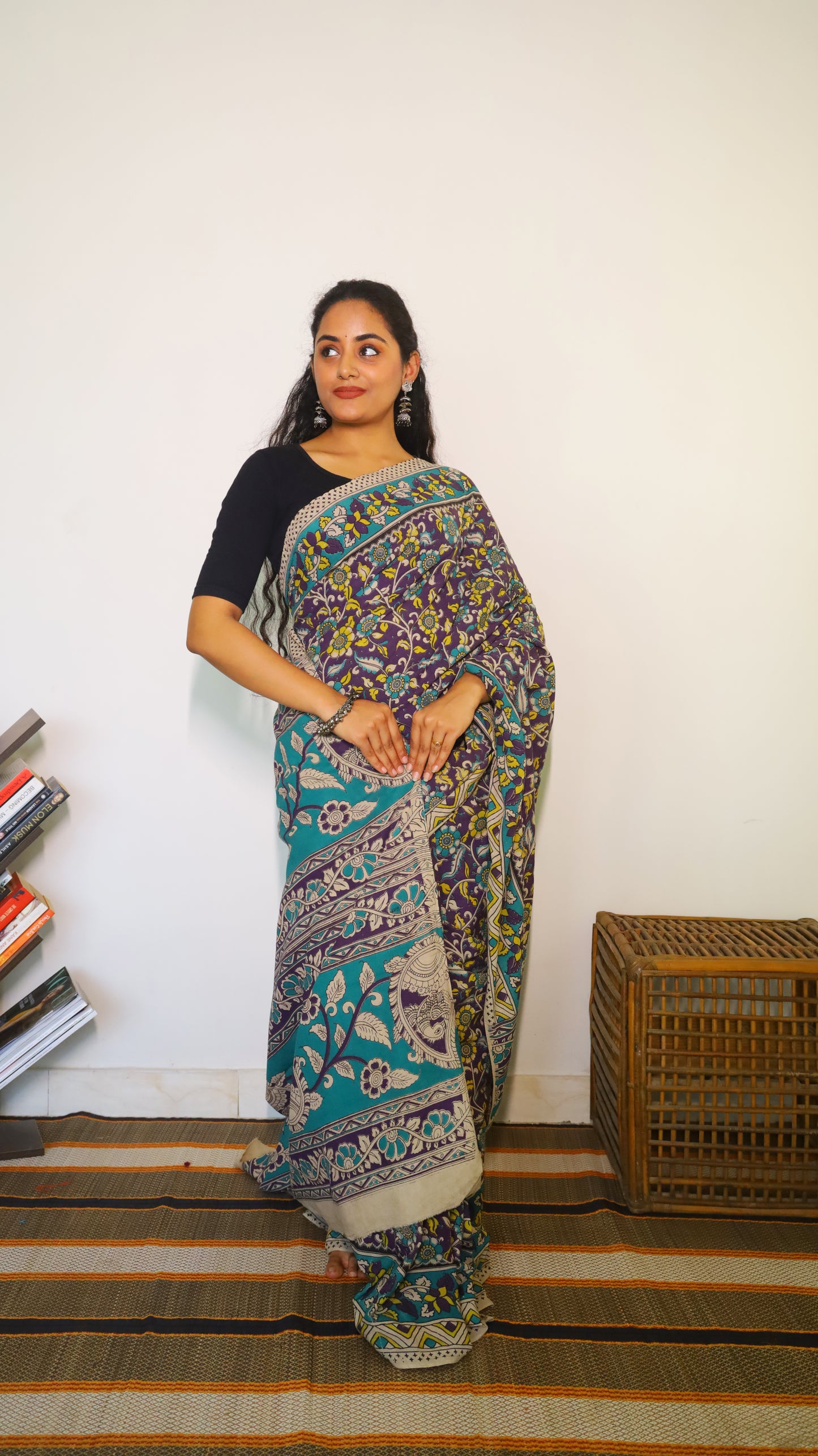 Breathable purple cotton kalamkari saree featuring floral buttas and geometric border - BOOMIKA