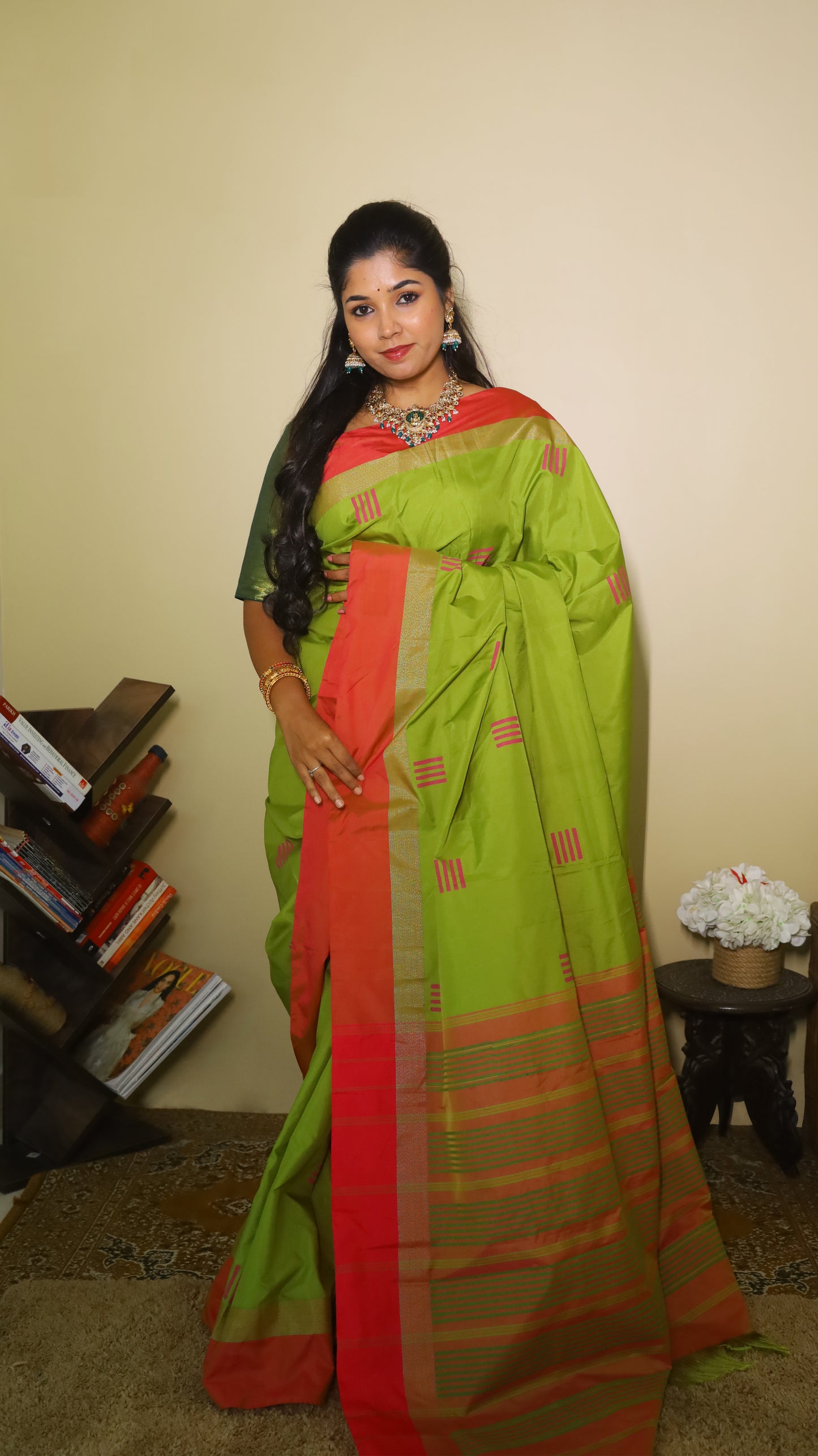 Elegant light green Pasmina silk saree adorned with delicate pink woven motifs, and contrasting pink-gold border - AVANTHIKA