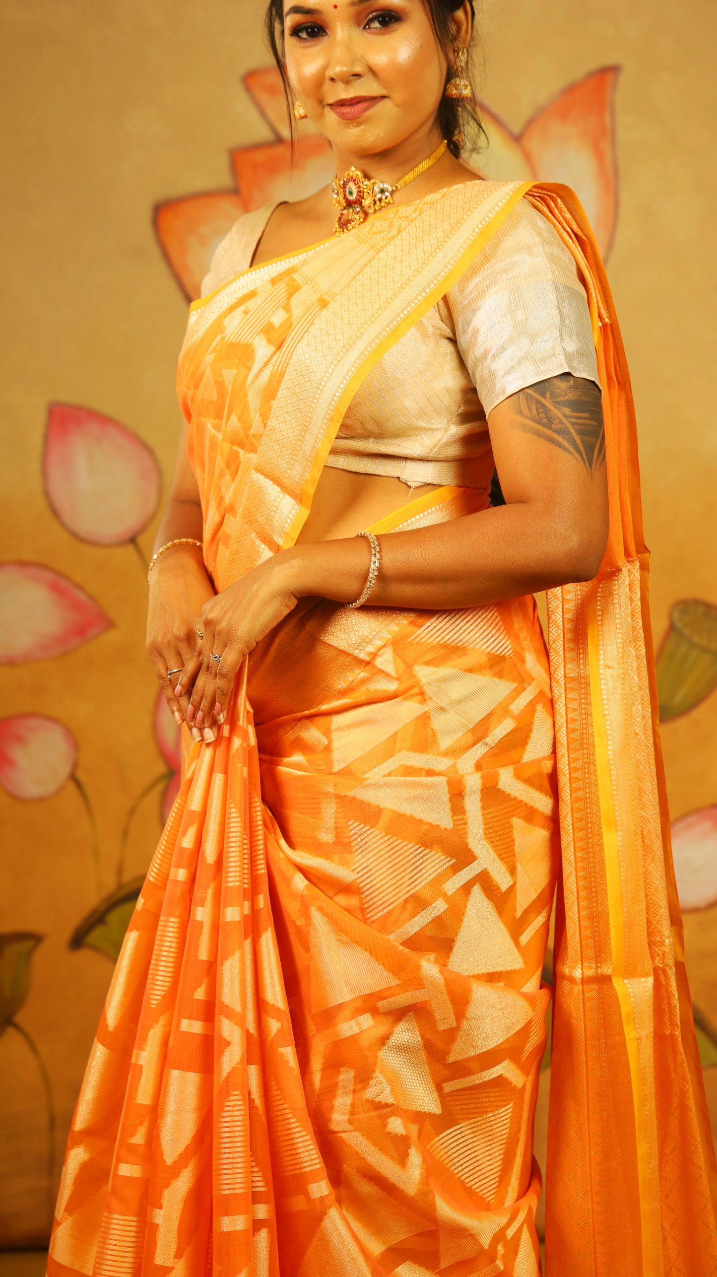 Luxurious Manipuri cotton saree in bright orange and brocade design with gold zari border - BOOMIKA