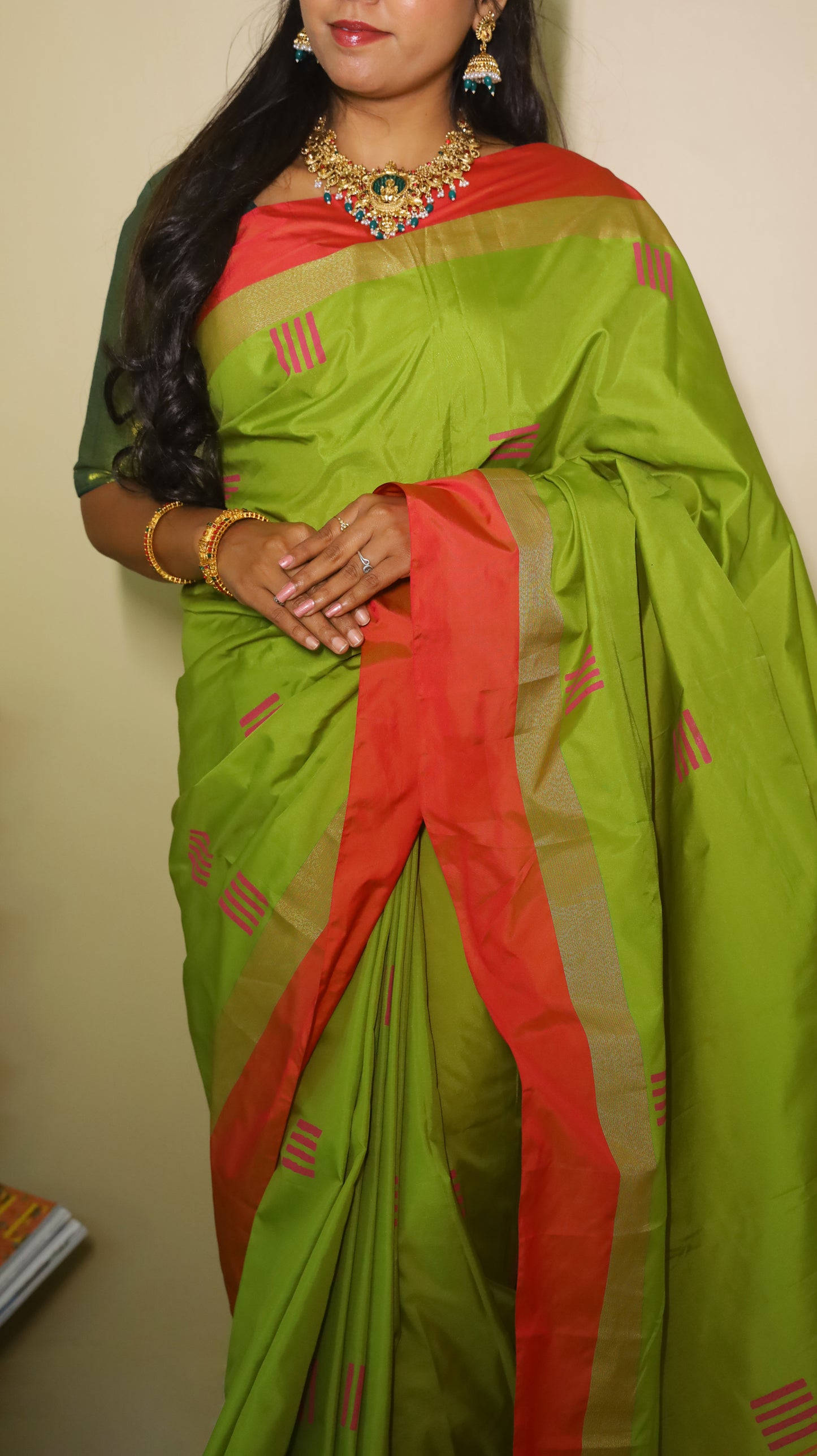 Elegant light green Pasmina silk saree adorned with delicate pink woven motifs, and contrasting pink-gold border - AVANTHIKA