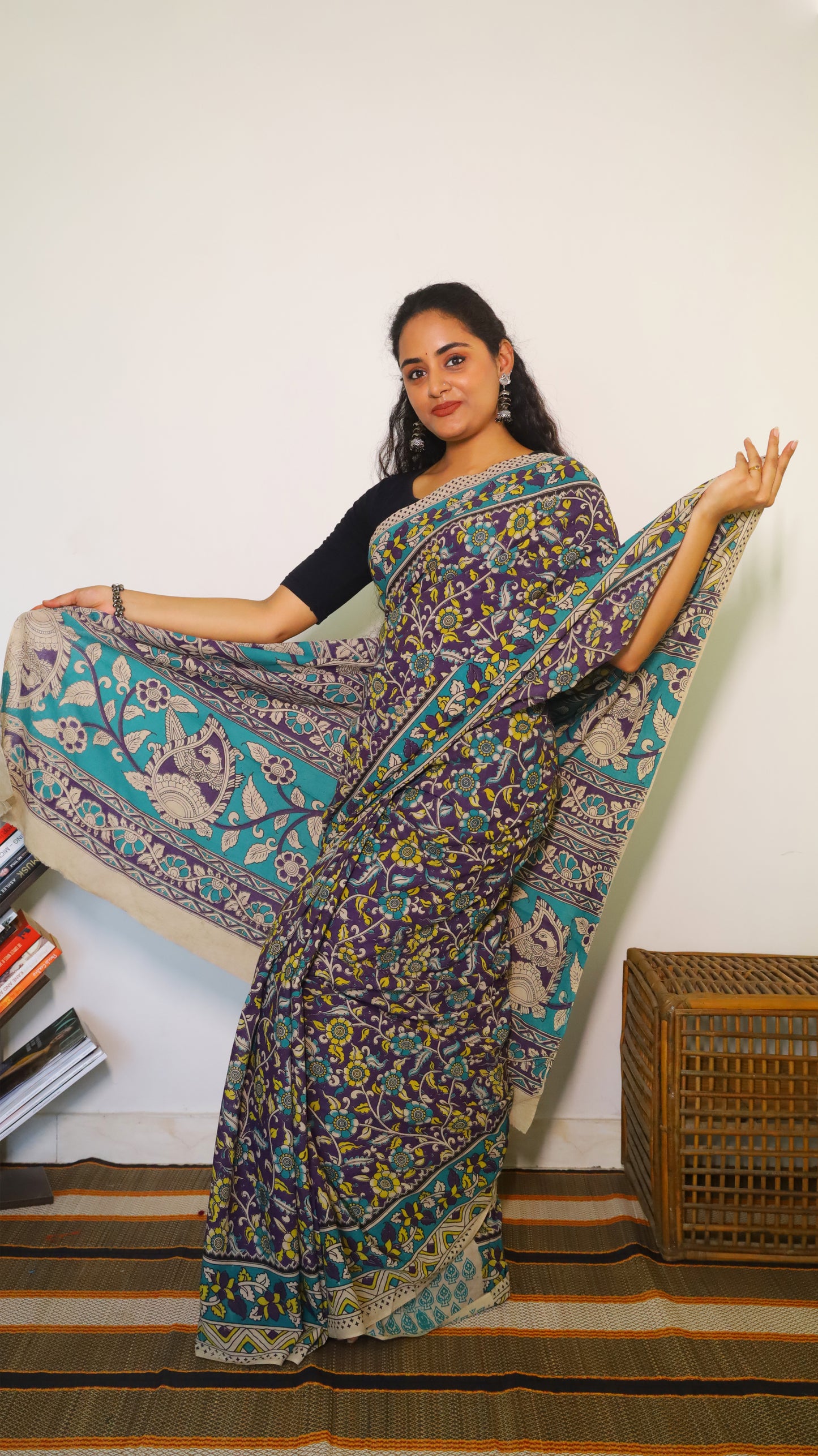 Breathable purple cotton kalamkari saree featuring floral buttas and geometric border - BOOMIKA