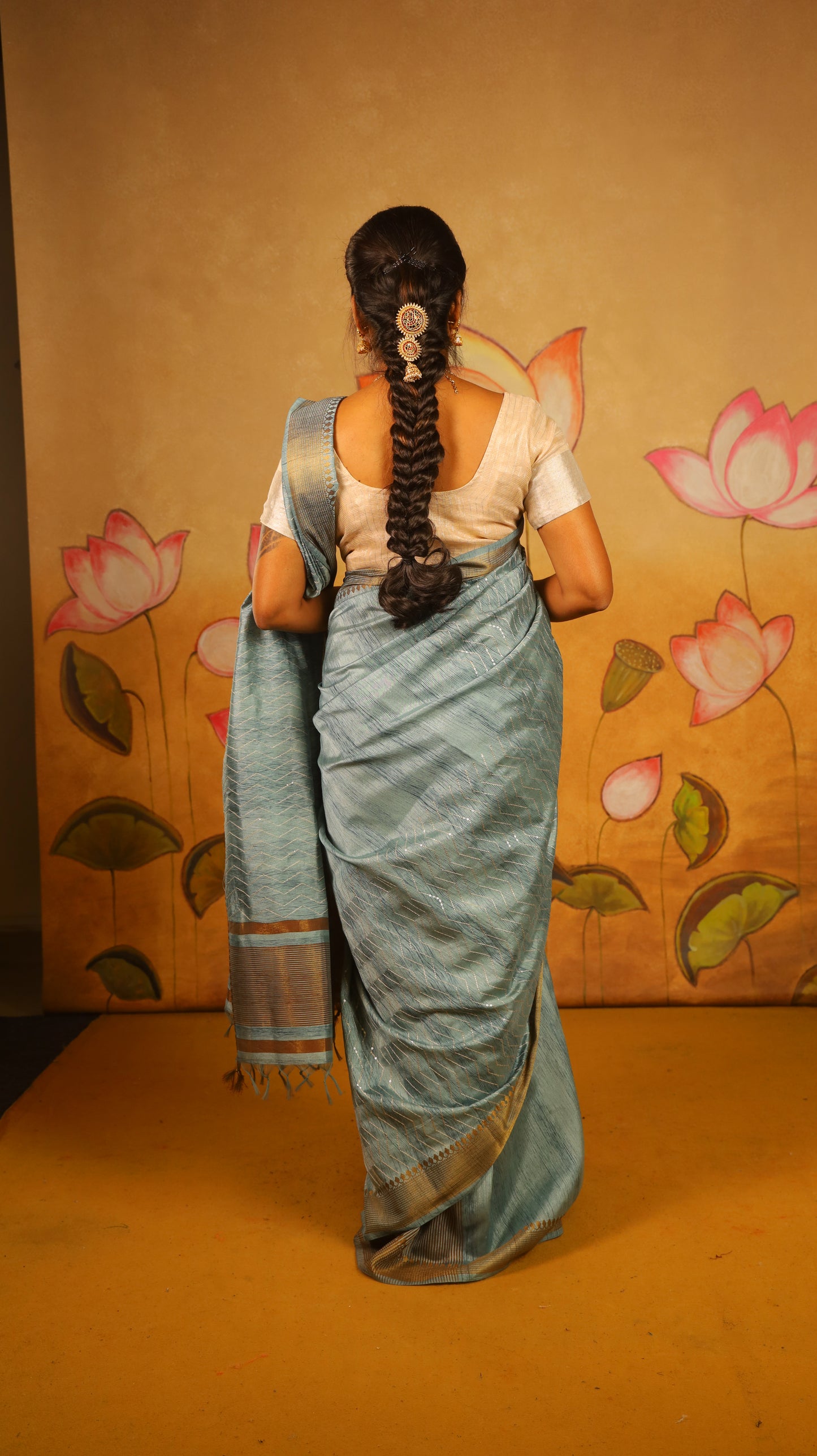 Elegant bright and breezy, this turquoise blue saree with an earthy dull gold border. Perfect for poojas, or gifting - PREETHIKA