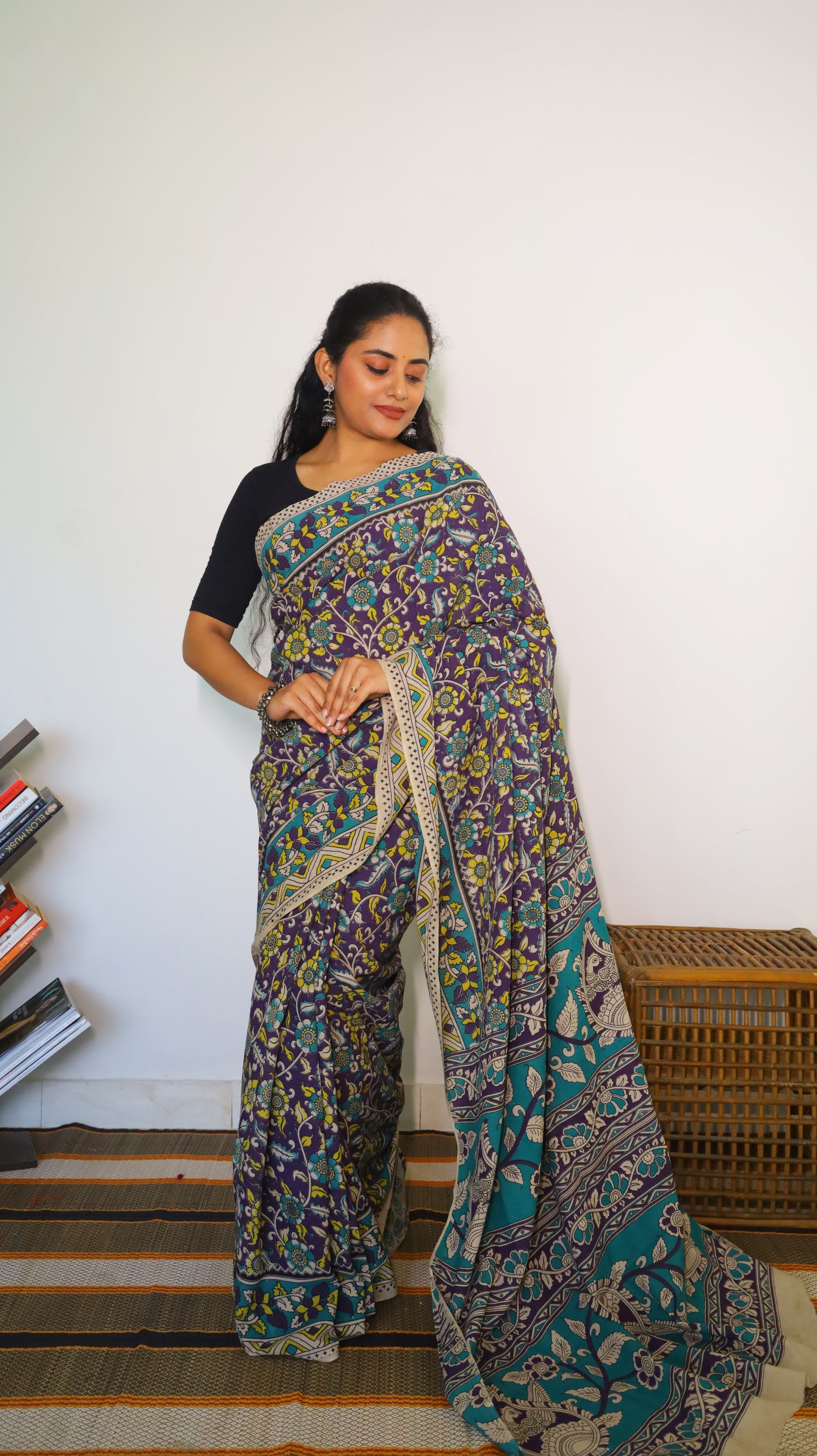 Breathable purple cotton kalamkari saree featuring floral buttas and geometric border - BOOMIKA