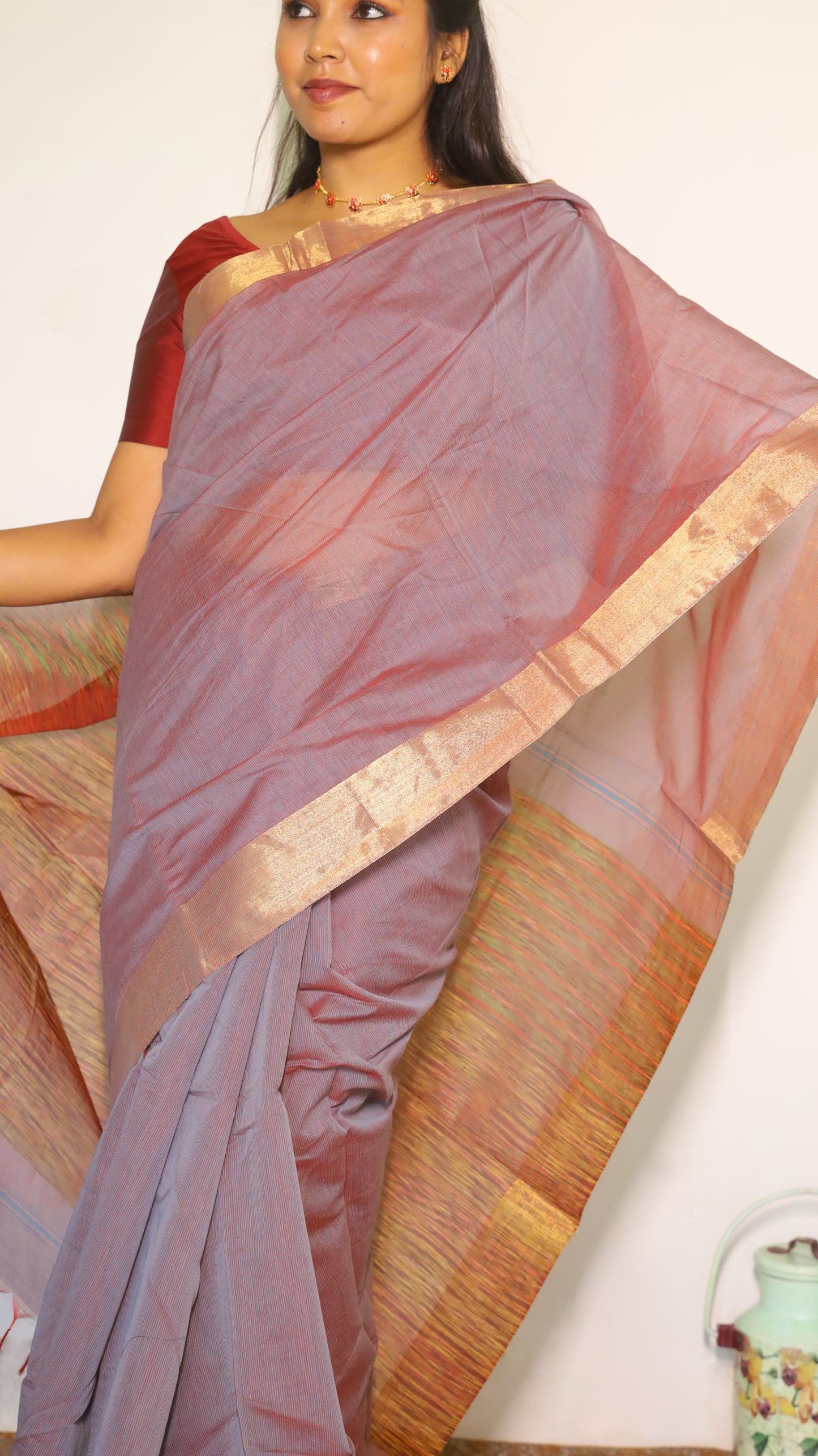 Lightweight maroon Jute Cotton saree with a textured multicolored weave across the body with tasseled pallu and muted border which gives a subtle festive look - BOOMIKA