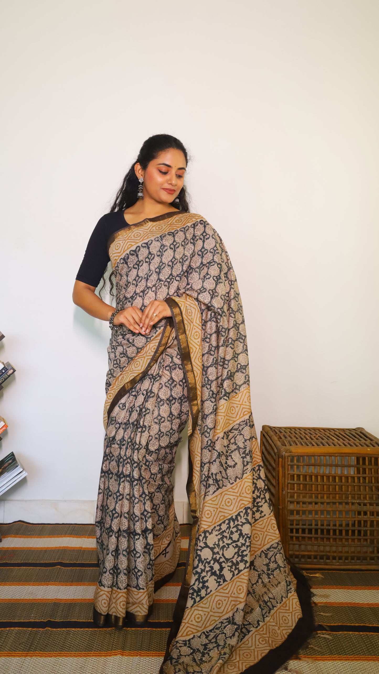 Lightweight beige handloom cotton kalamkari saree with intricate black all-over floral and geometric motifs - BOOMIKA