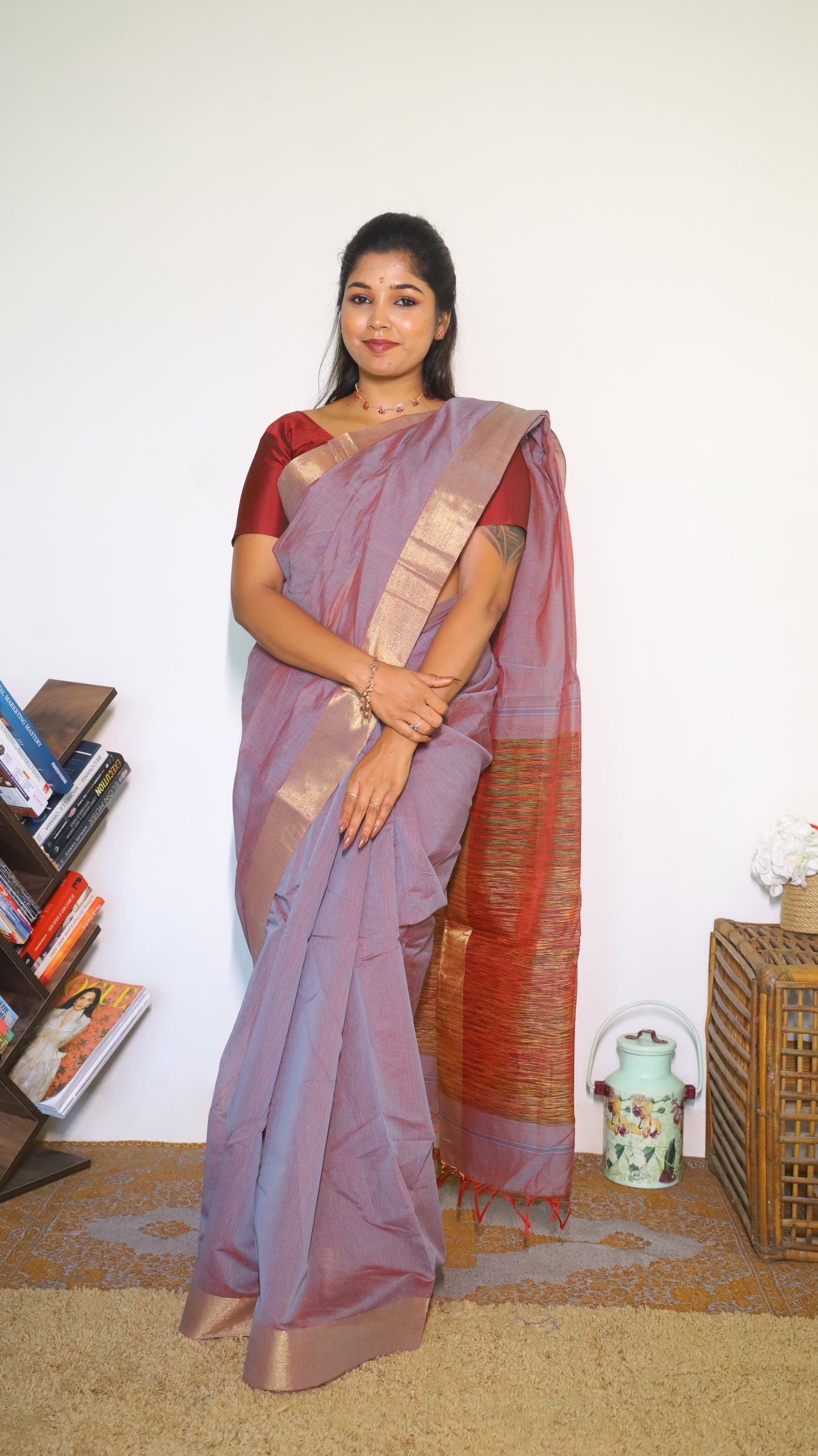 Lightweight maroon Jute Cotton saree with a textured multicolored weave across the body with tasseled pallu and muted border which gives a subtle festive look - BOOMIKA