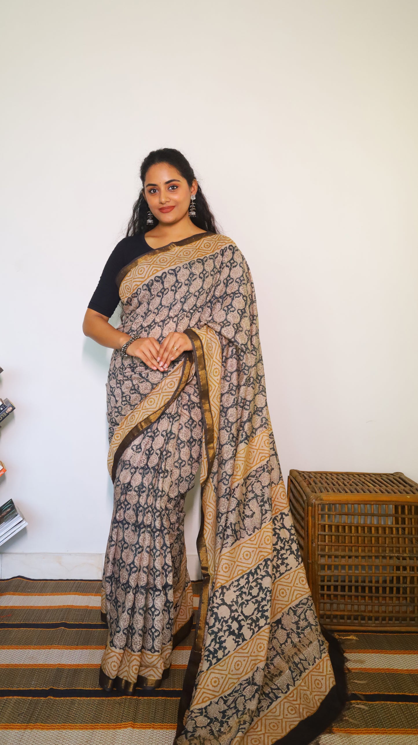 Lightweight beige handloom cotton kalamkari saree with intricate black all-over floral and geometric motifs - BOOMIKA