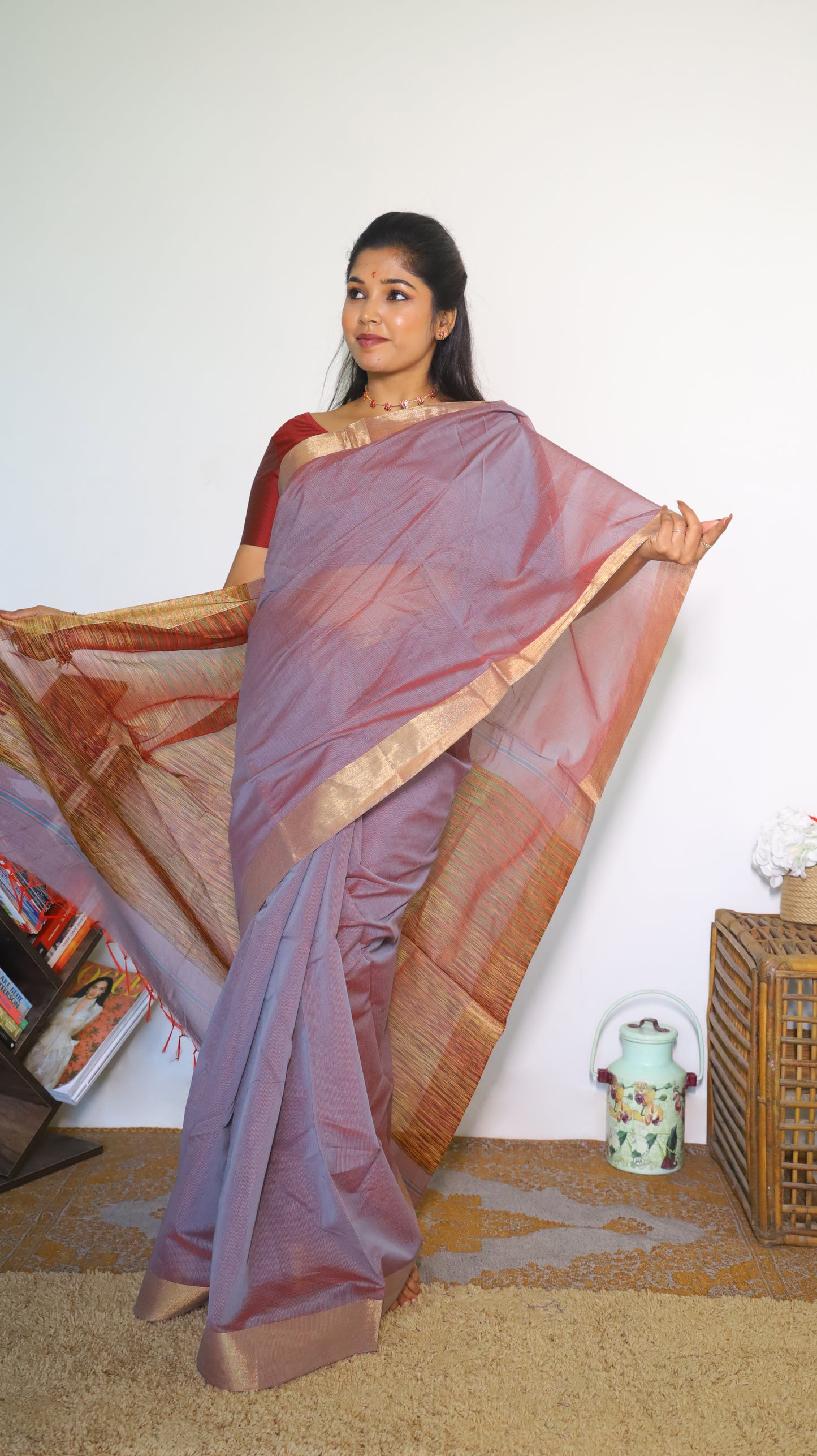 Lightweight maroon Jute Cotton saree with a textured multicolored weave across the body with tasseled pallu and muted border which gives a subtle festive look - BOOMIKA