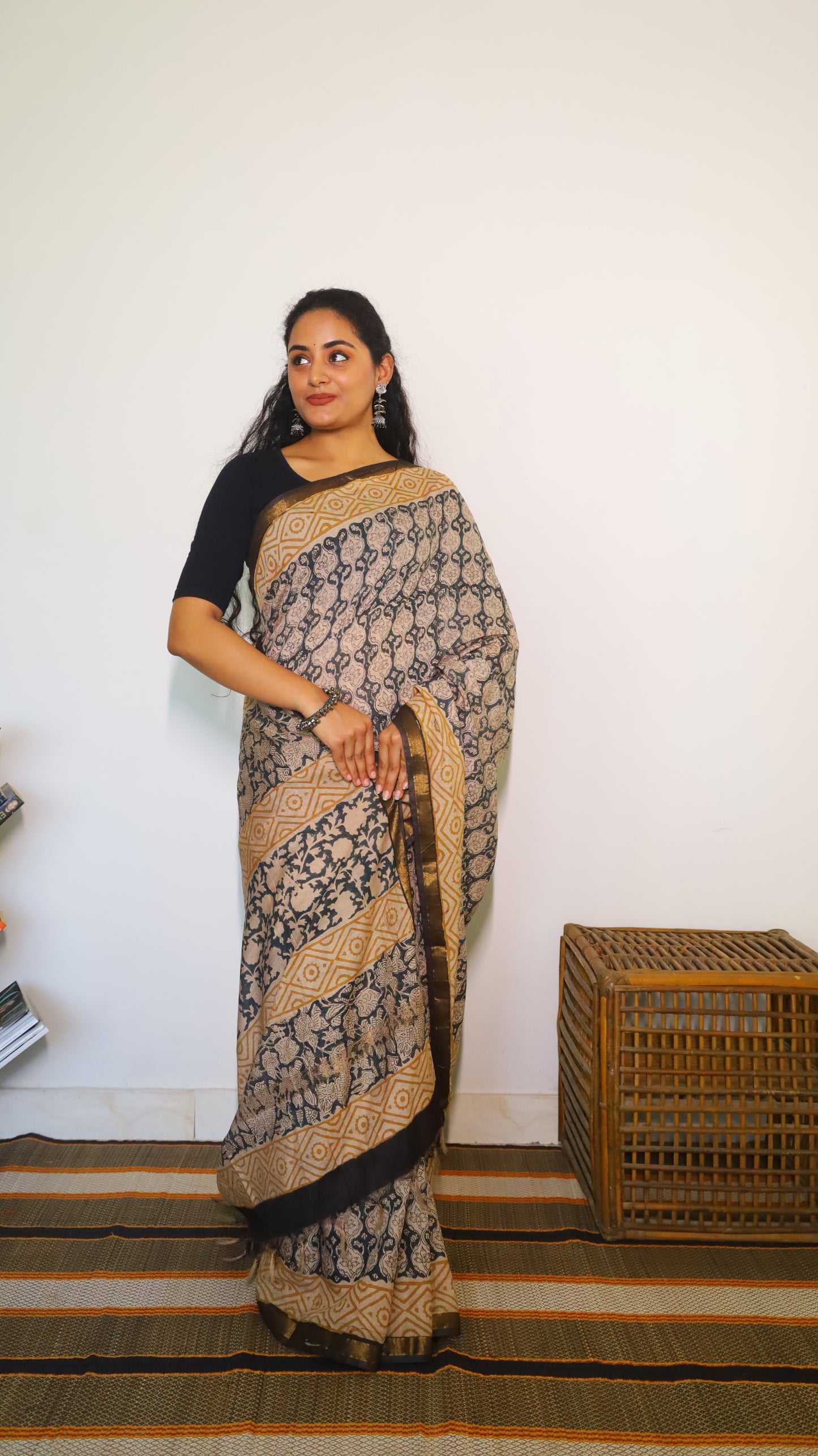 Lightweight beige handloom cotton kalamkari saree with intricate black all-over floral and geometric motifs - BOOMIKA