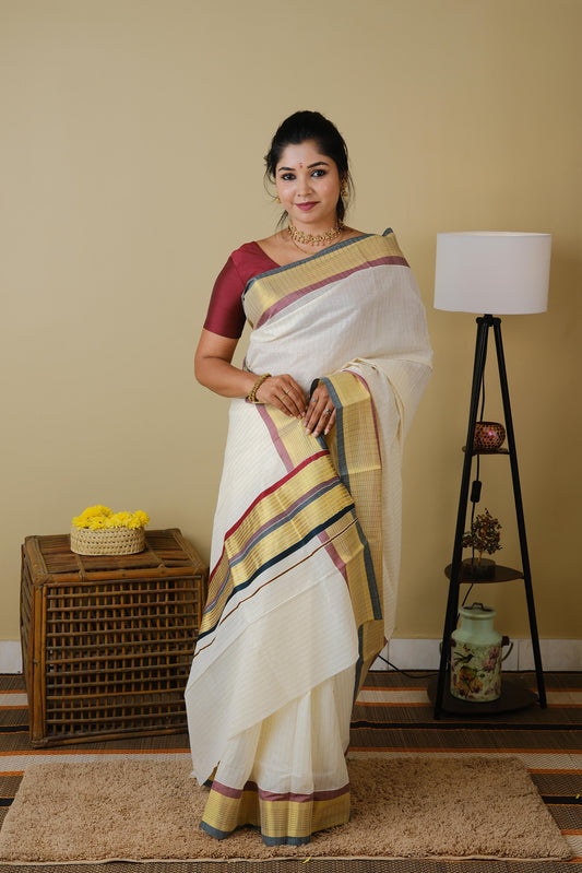 Pure kasavu cotton with striped zari body and double coloured border and pallu in traditional green and maroon - AVANTHIKA