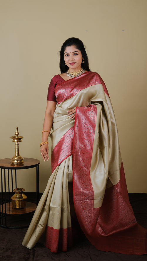 Mango silk brocade in deep cream with vairaoosi and silver motif body with blood red contrast pallu and double silver zari border - AVANTHIKA (20009023)