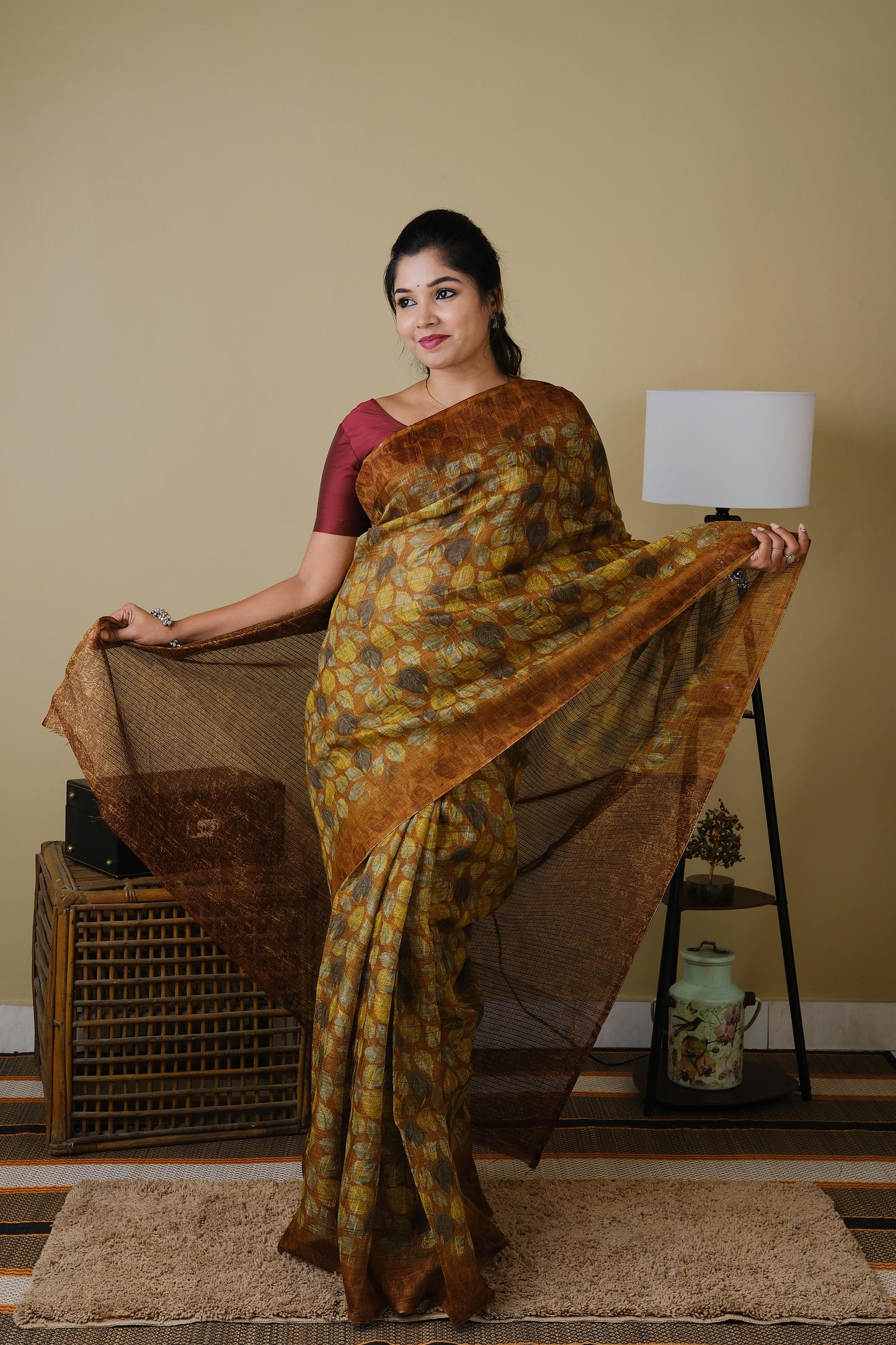 Jute cotton in brown with falling leaves pattern and brown border - BOOMIKA