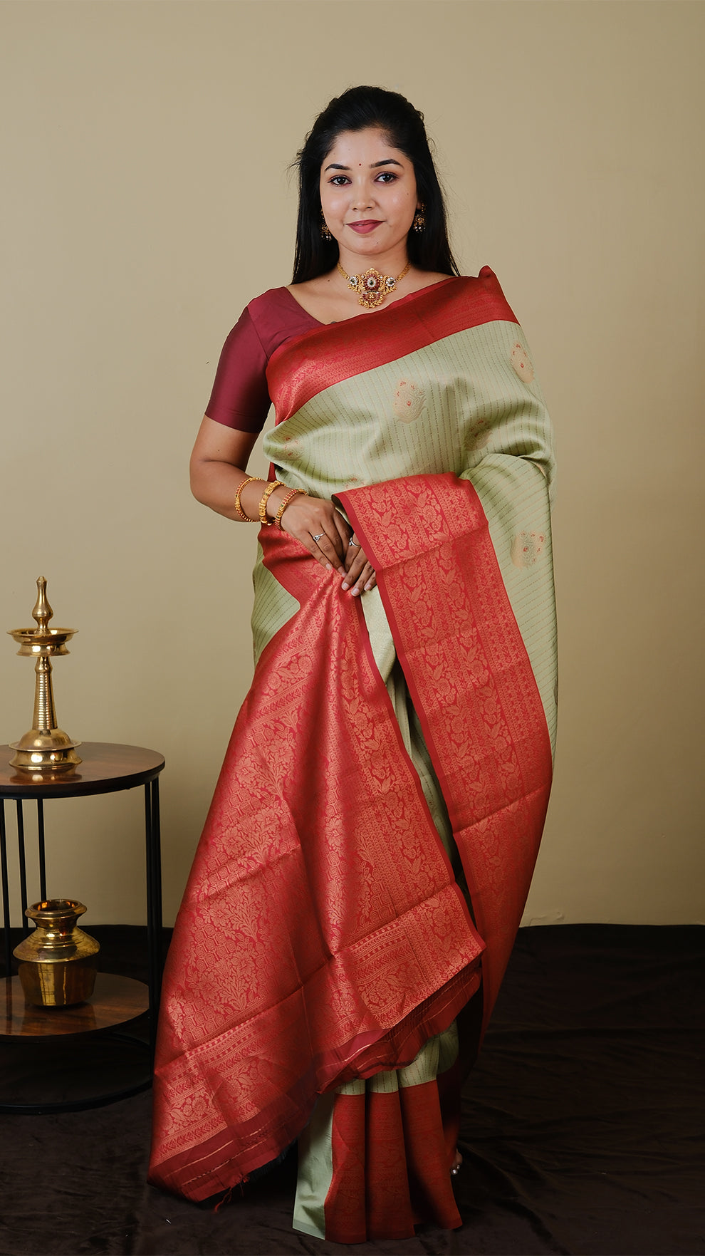 Soft silk brocade in pistha green with vairaoosi and gold motif body and chilli red contrast pallu with double zari border - AVANTHIKA (20009007)