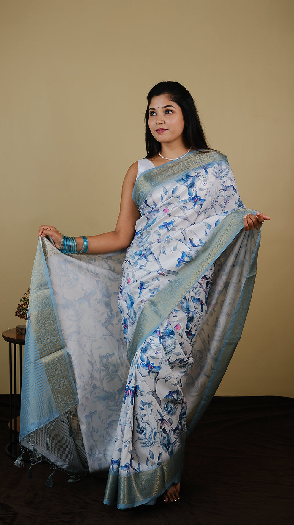Digial print off white saree with all over bird print and teal green zari border - AVANTHIKA (20012008)