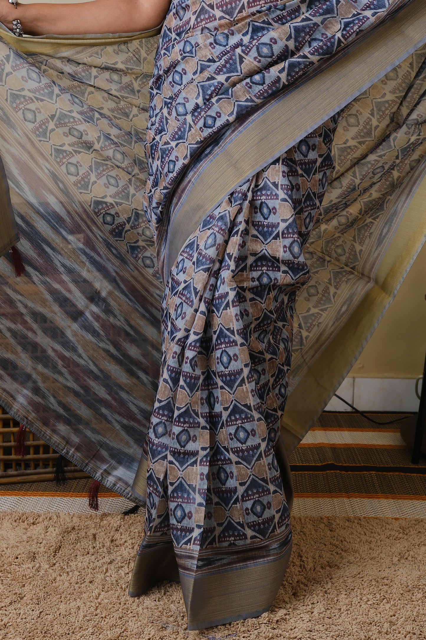 Soft cotton in light grey with all over tribal print and self zari border - BOOMIKA