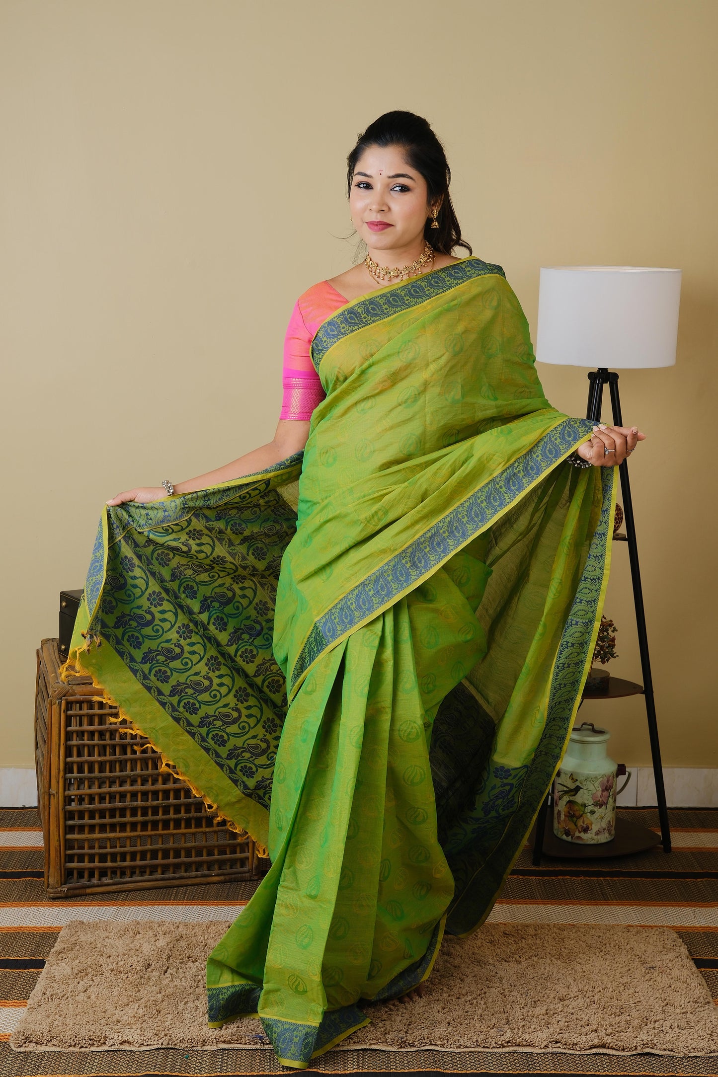 Handloom cotton in parrot green double shot with blue leaf border - BOOMIKA