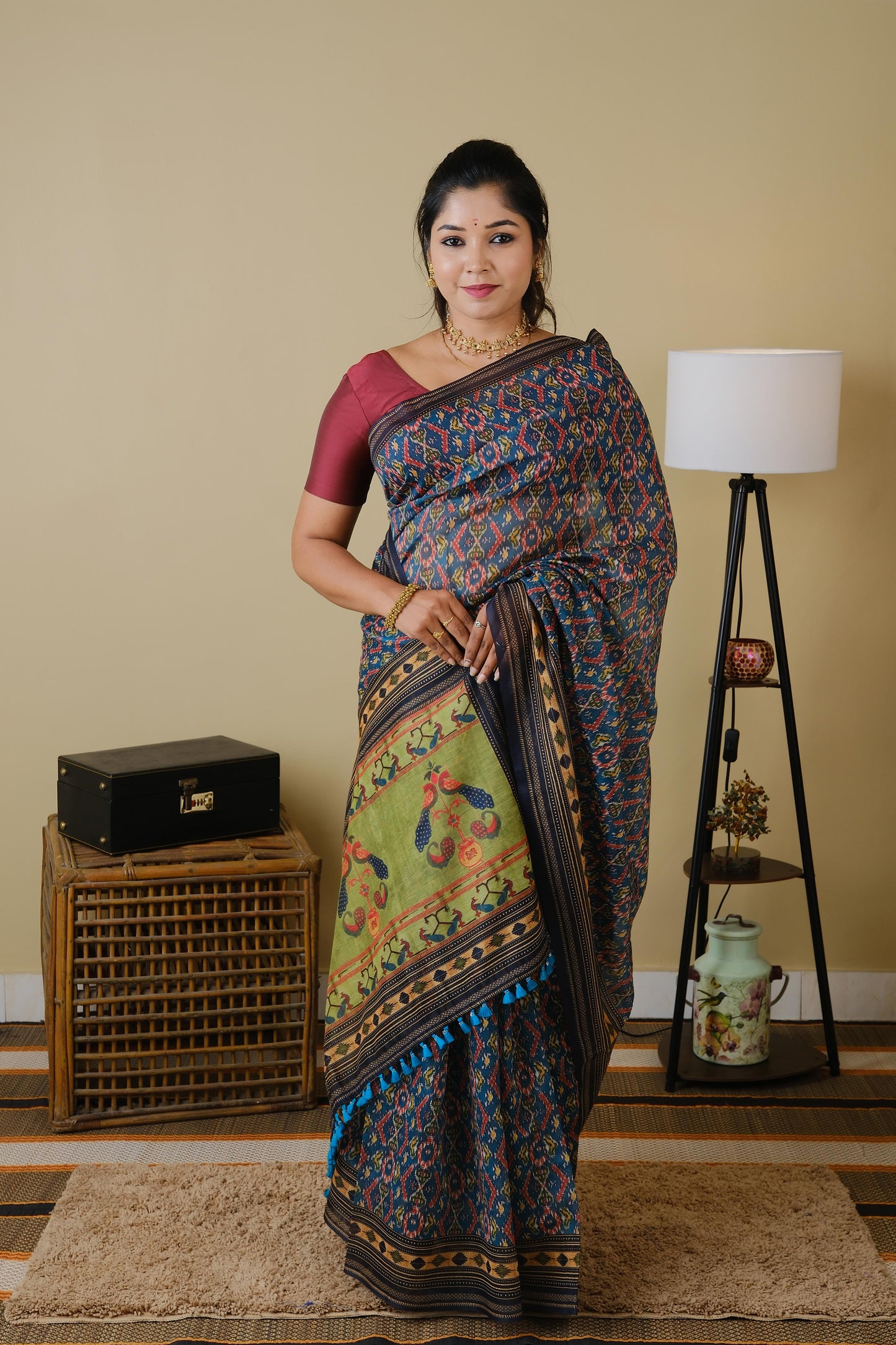 Soft cotton in teal green with patolla print and black border - BOOMIKA