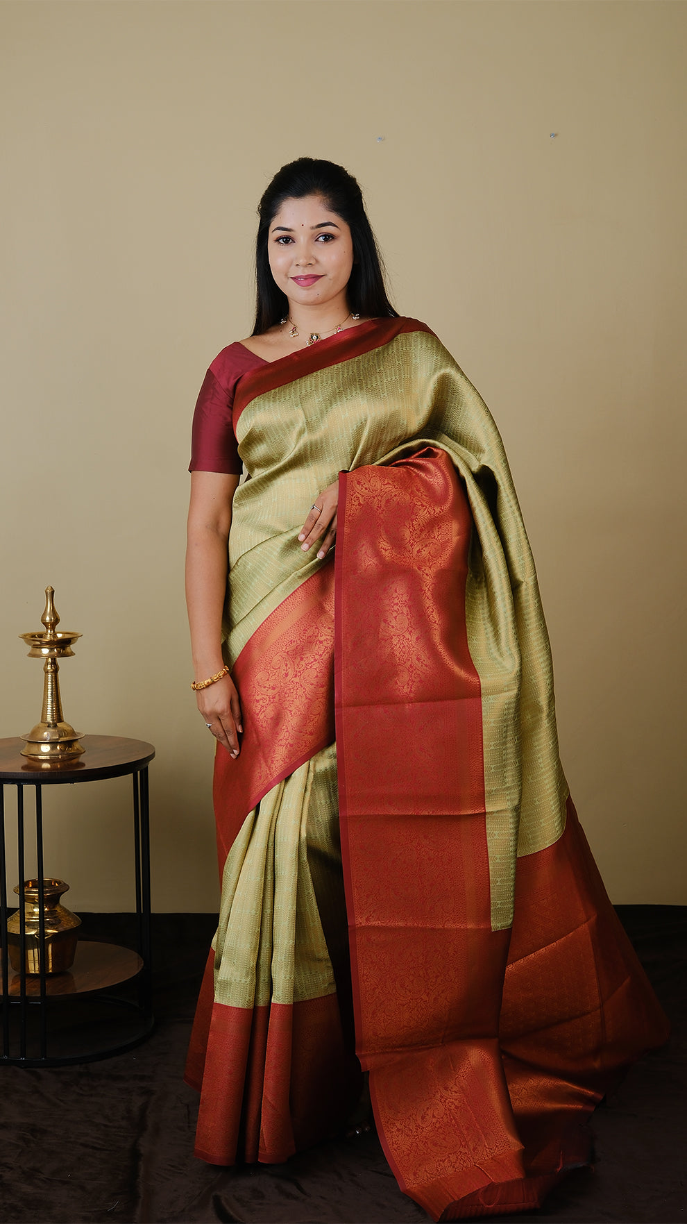 Soft silk brocade in pistha green with all over jal gold zari and gold motif body and chilli red contrast pallu with double border - AVANTHIKA (20009011)