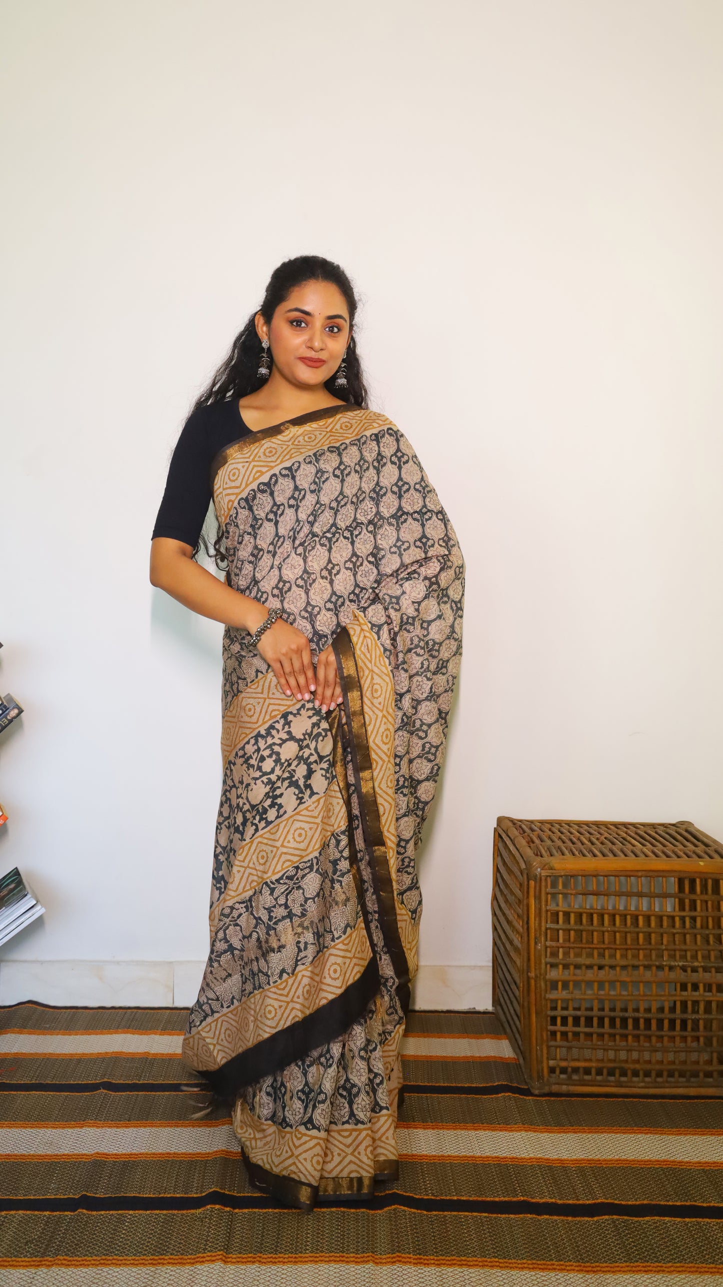 Lightweight beige handloom cotton kalamkari saree with intricate black all-over floral and geometric motifs - BOOMIKA