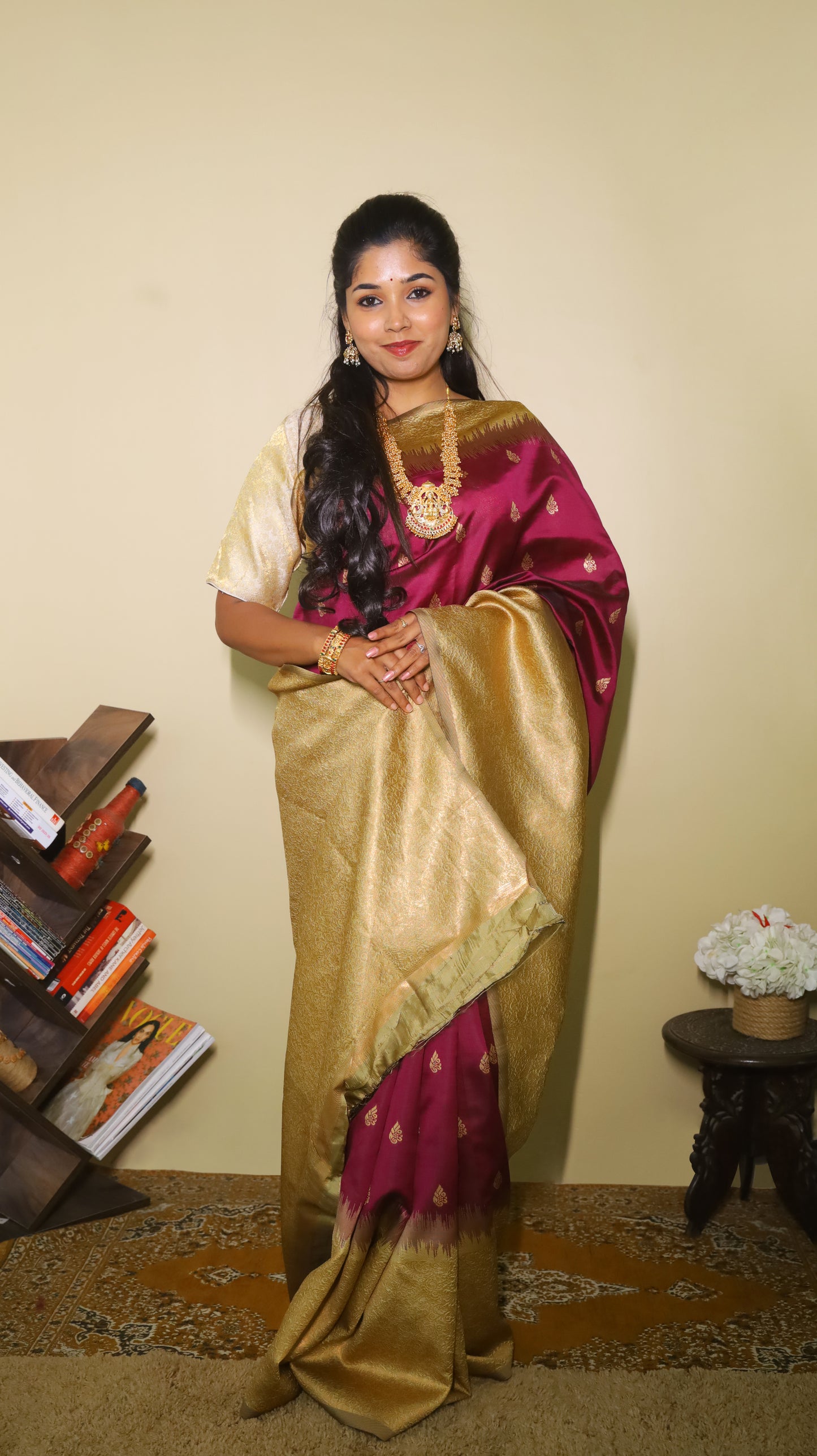 Graceful Soft Silk Saree in a rich maroonish wine body with gold zari border and delicate buttas - AVANTHIKA