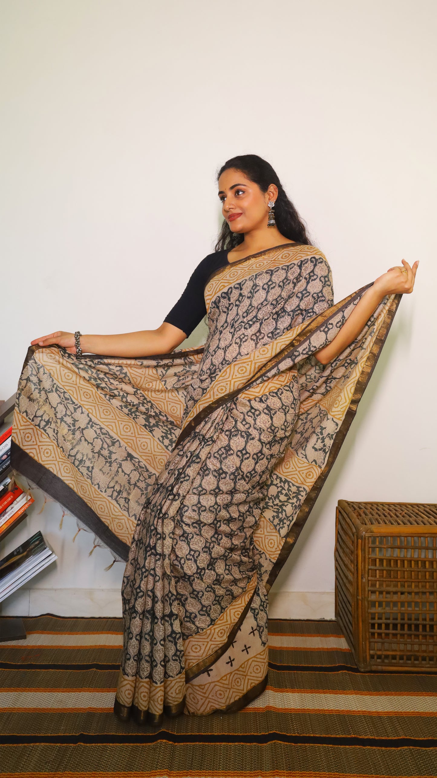 Lightweight beige handloom cotton kalamkari saree with intricate black all-over floral and geometric motifs - BOOMIKA