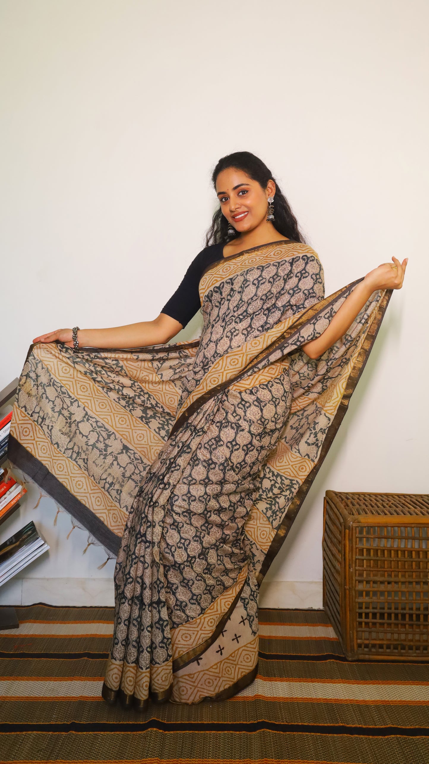Lightweight beige handloom cotton kalamkari saree with intricate black all-over floral and geometric motifs - BOOMIKA