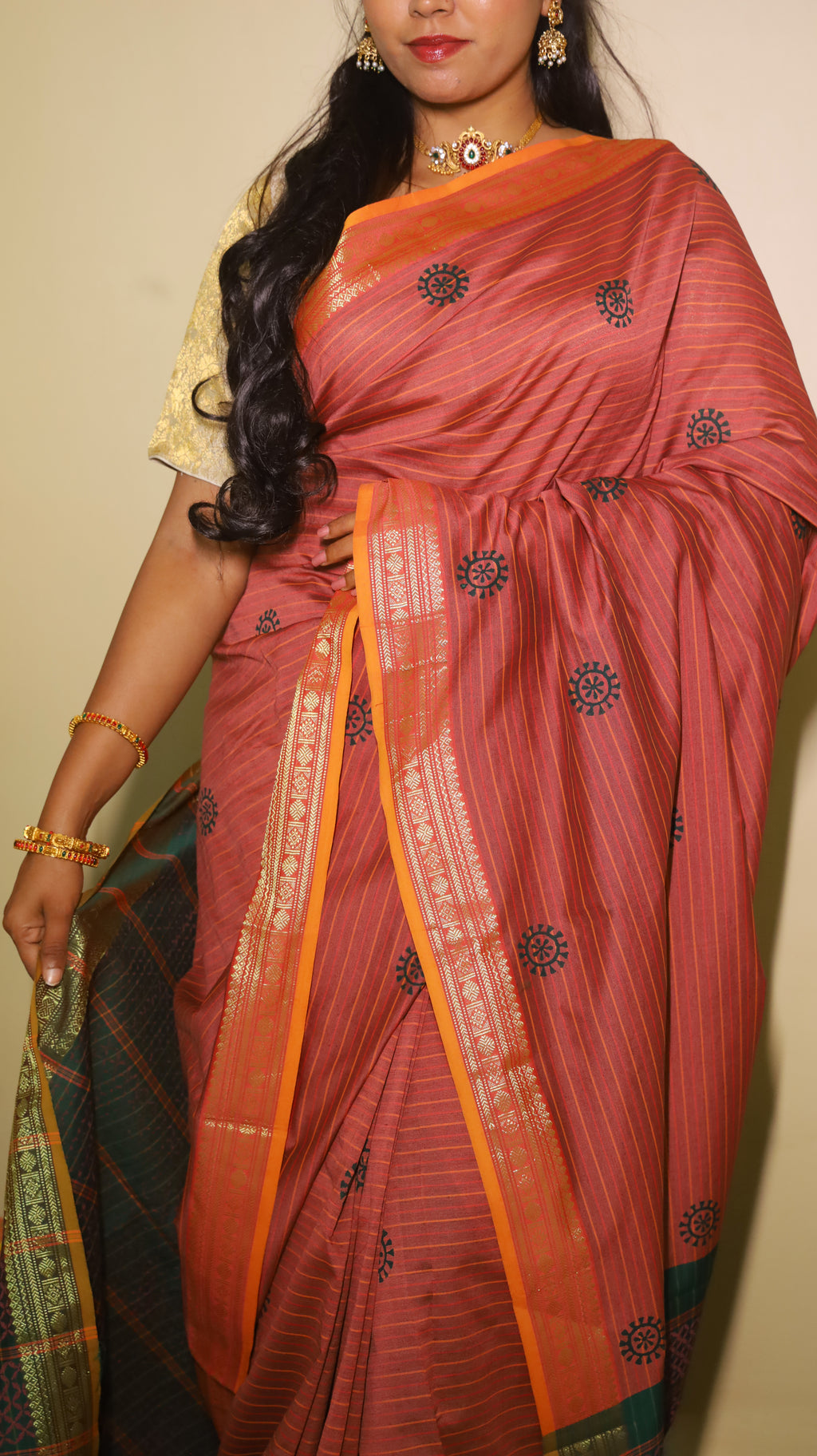 Block print kanchi cotton with pinkish brown body and light orange gold zari border with contrast dark green pallu - KRITHIKA (40012002)
