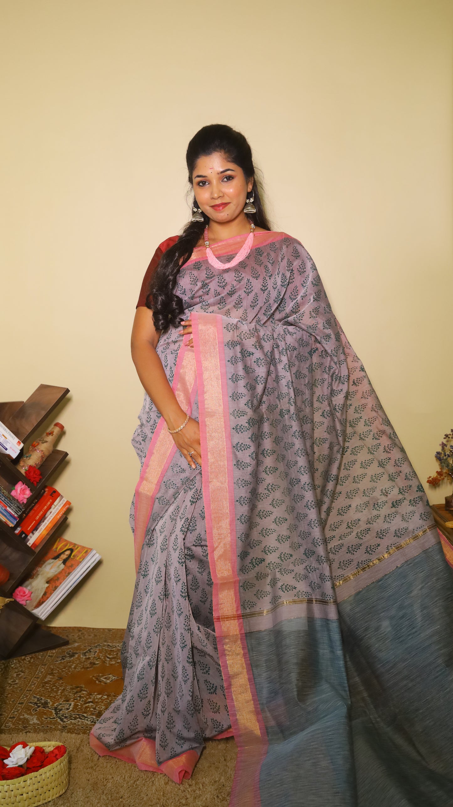 Handprinted manipuri cotton saree patterned with delicate green floral buttas, soft pink border and tasseled edge - BOOMIKA