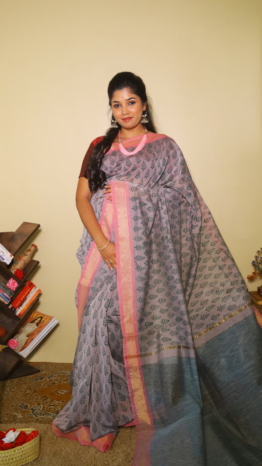 Handprinted manipuri cotton saree patterned with delicate green floral buttas, soft pink border and tasseled edge - BOOMIKA