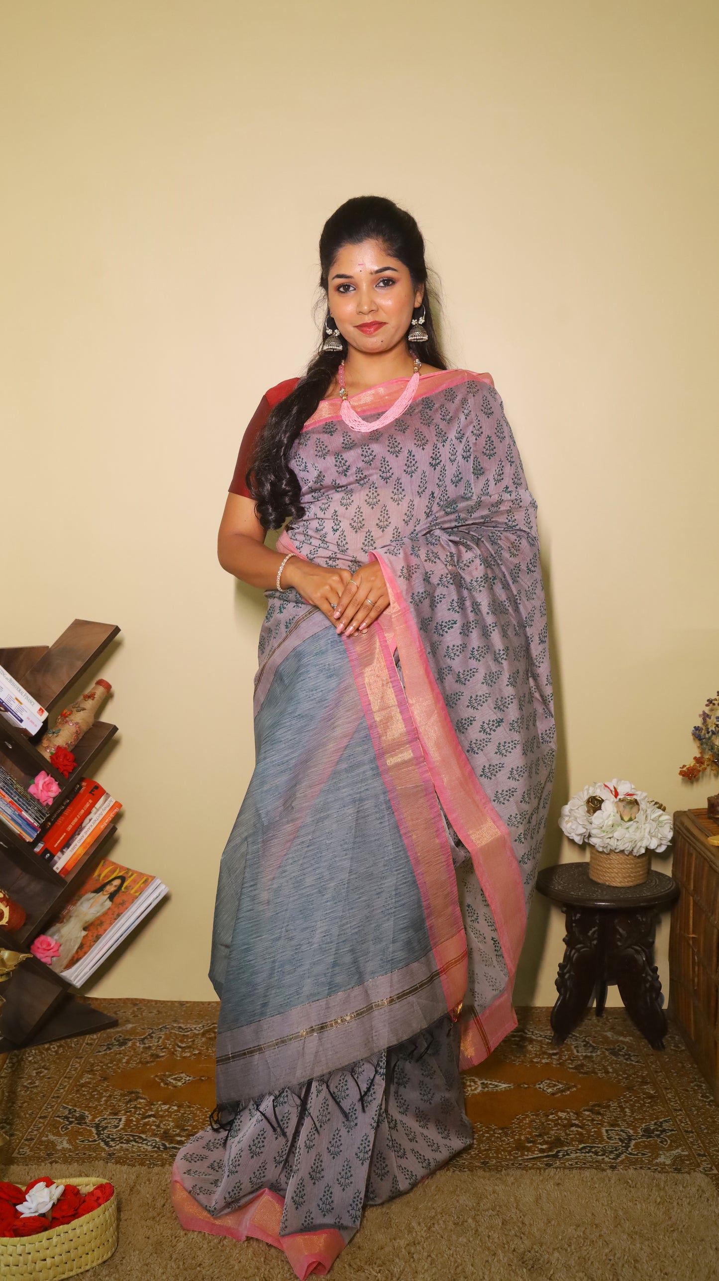 Handprinted manipuri cotton saree patterned with delicate green floral buttas, soft pink border and tasseled edge - BOOMIKA