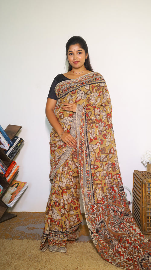 Vibrant mustard yellow soft cotton Kalamkari print saree with flowers and peacocks in light grey and black  - BOOMIKA
