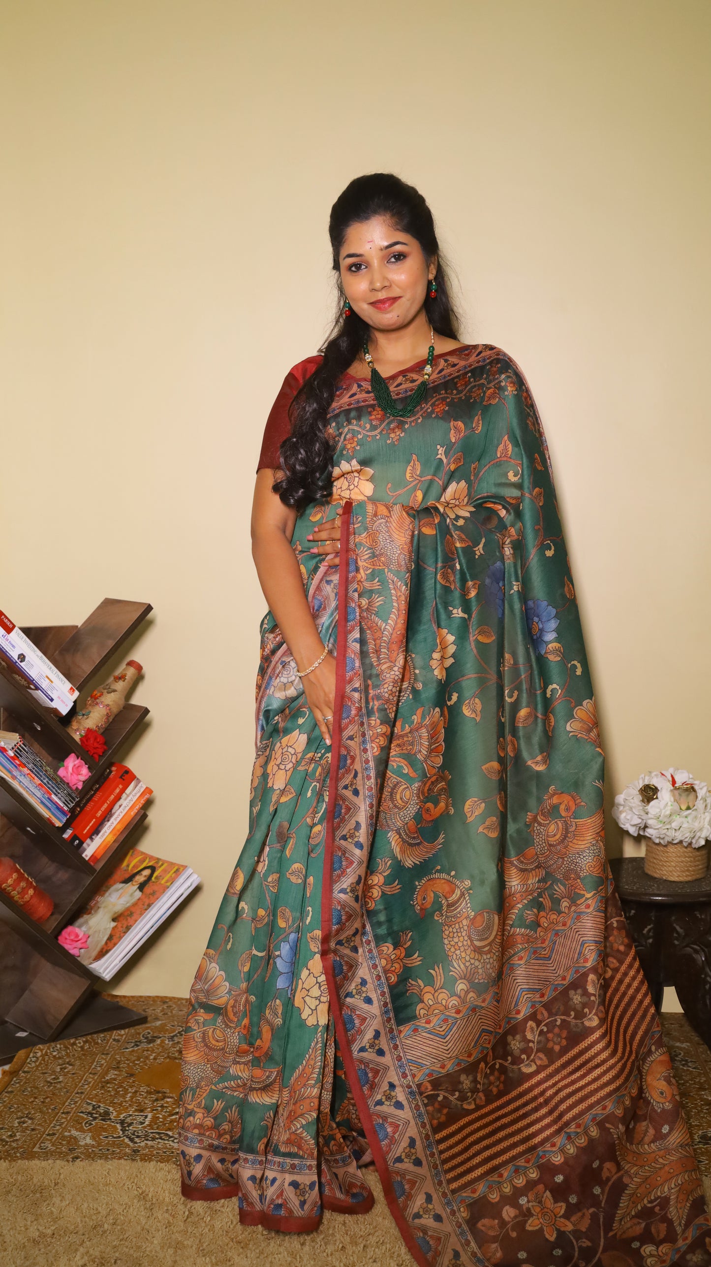 Exquisite deep bottle green silk cotton saree with floral and peacock motifs, paired with a maroon border - VEDHIKA