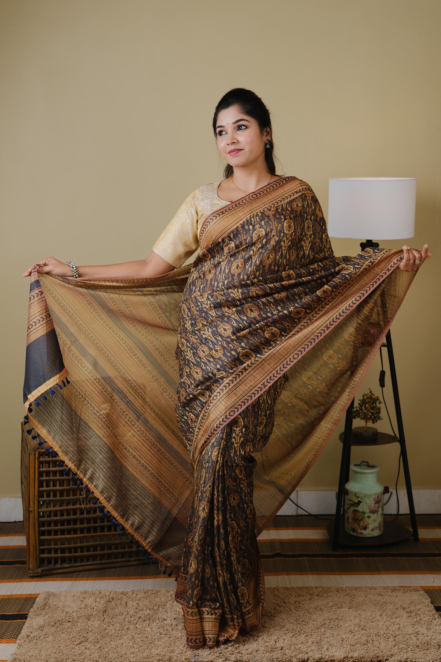 Soft cotton in black with golden tribal prints and pinkish brown border - BOOMIKA