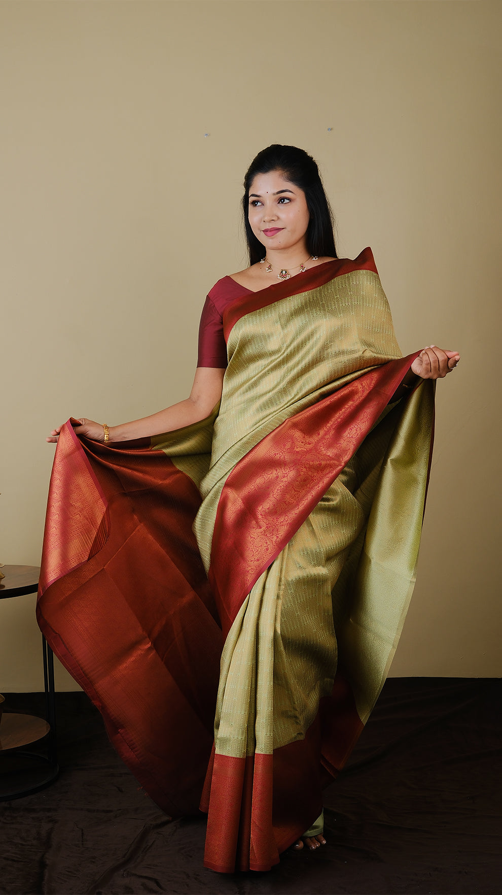 Soft silk brocade in pistha green with all over jal gold zari and gold motif body and chilli red contrast pallu with double border - AVANTHIKA (20009011)