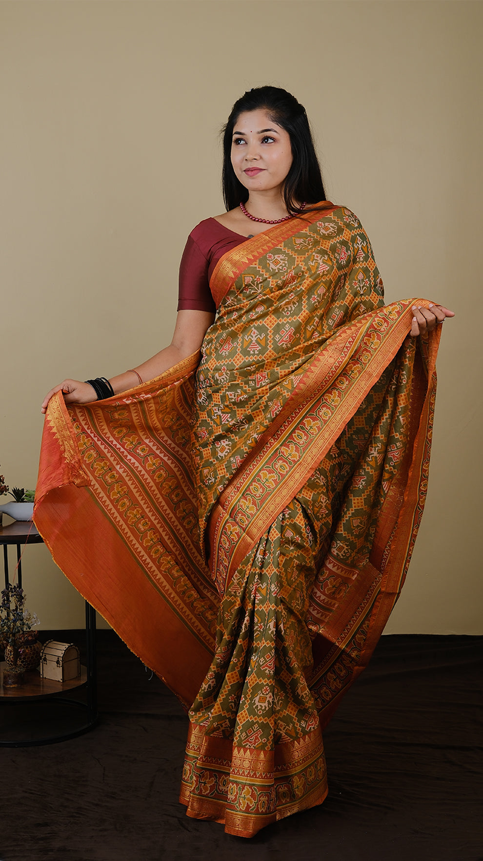 Soft silk patolla print in light olive green and orange with double zari border - AVANTHIKA (20010019)