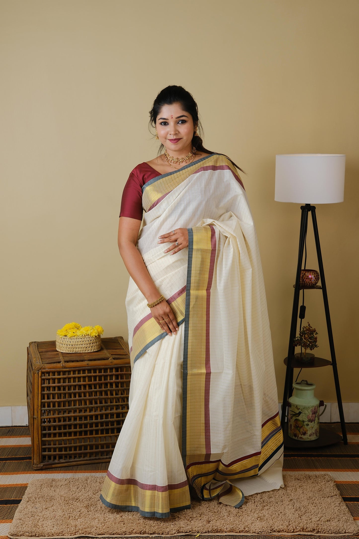 Pure kasavu cotton with striped zari body and double coloured border and pallu in traditional green and maroon - AVANTHIKA