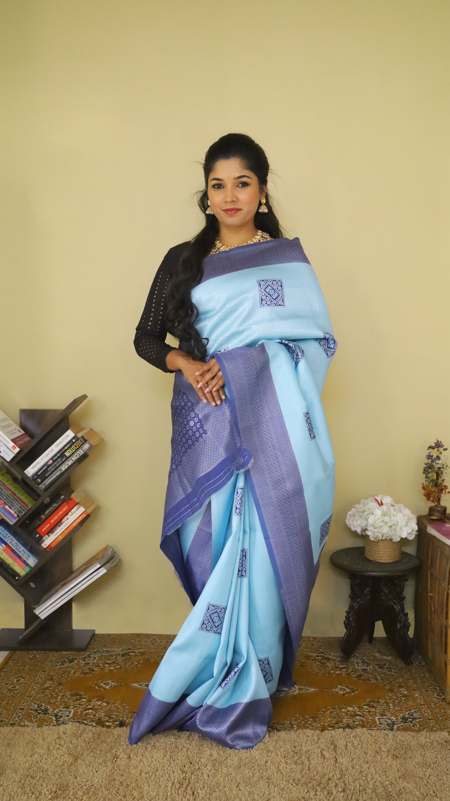 Graceful Soft Silk Saree with a soft light blue body, adorned with delicate buttas, and complemented by a bold dark blue border and pallu - AVANTHIKA
