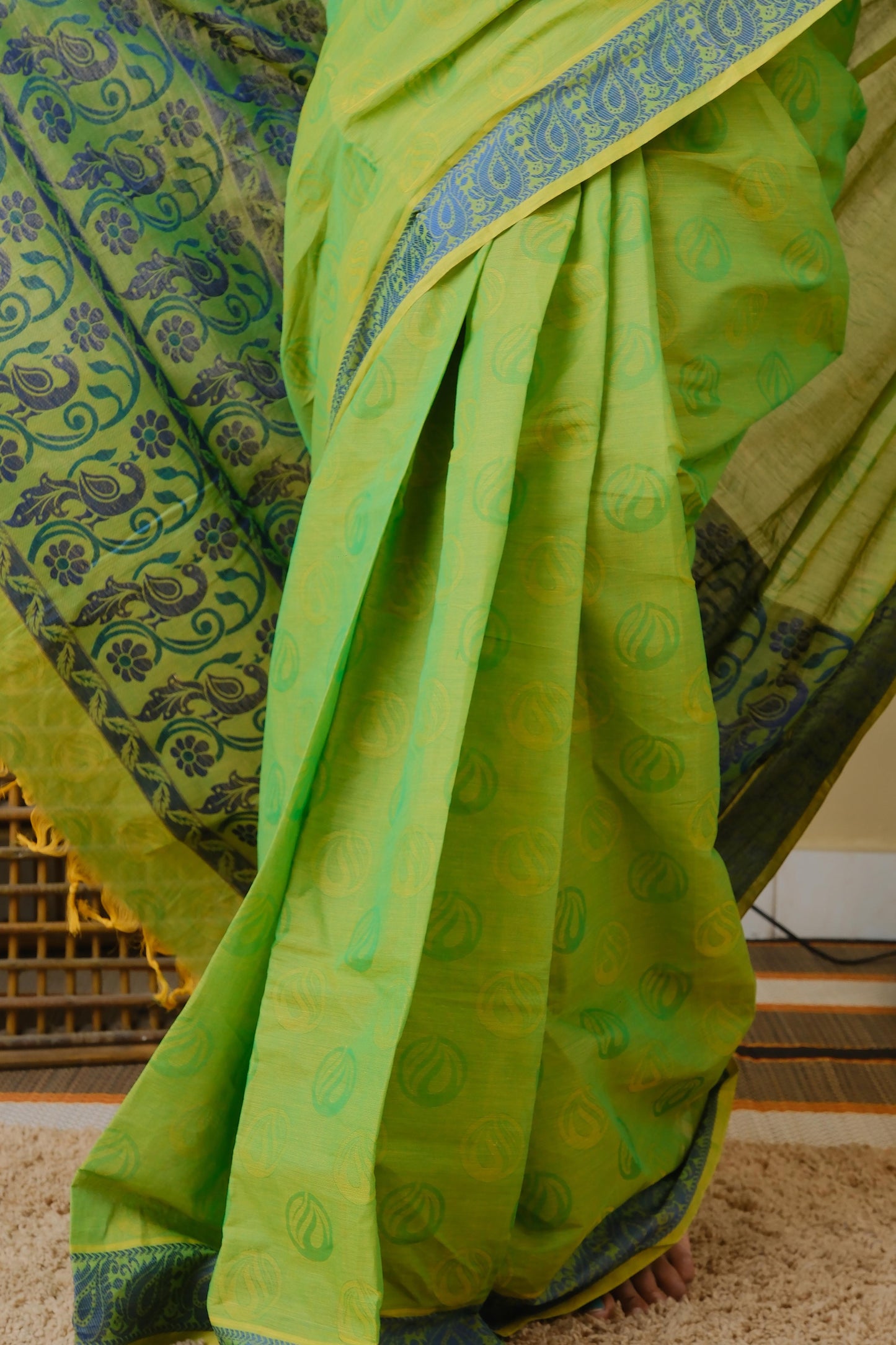 Handloom cotton in parrot green double shot with blue leaf border - BOOMIKA