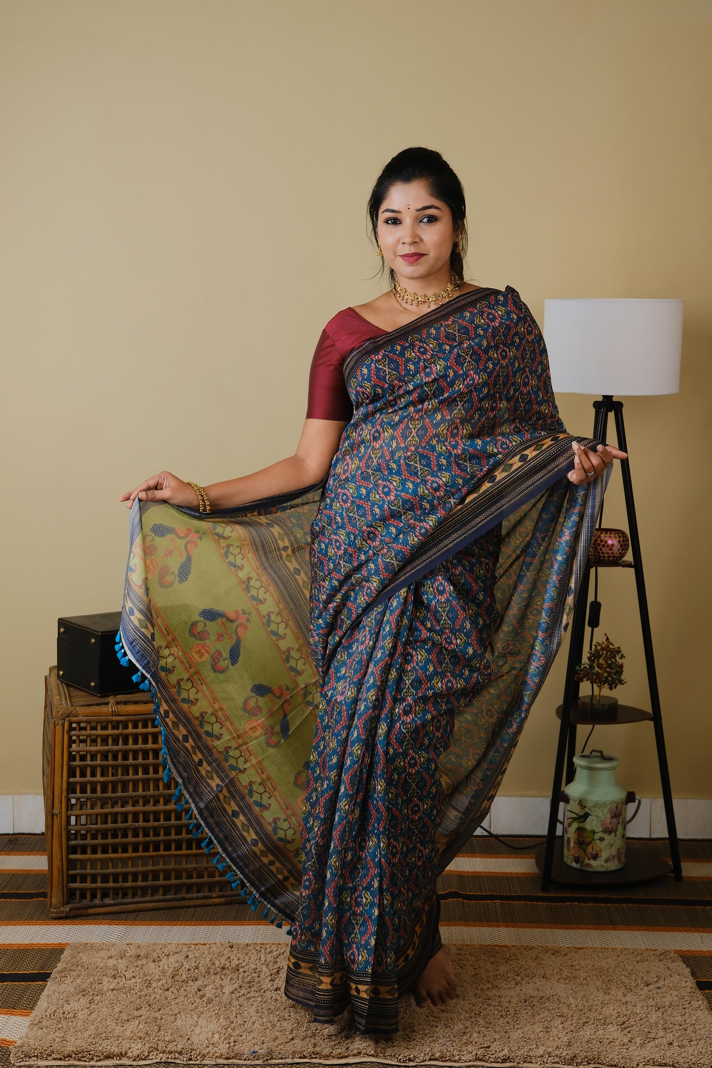 Soft cotton in teal green with patolla print and black border - BOOMIKA