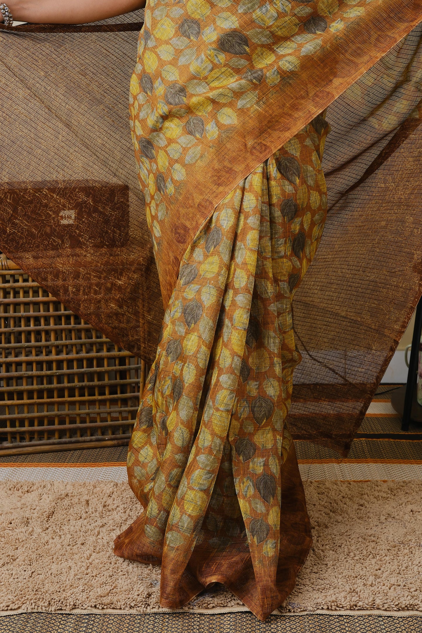 Jute cotton in brown with falling leaves pattern and brown border - BOOMIKA