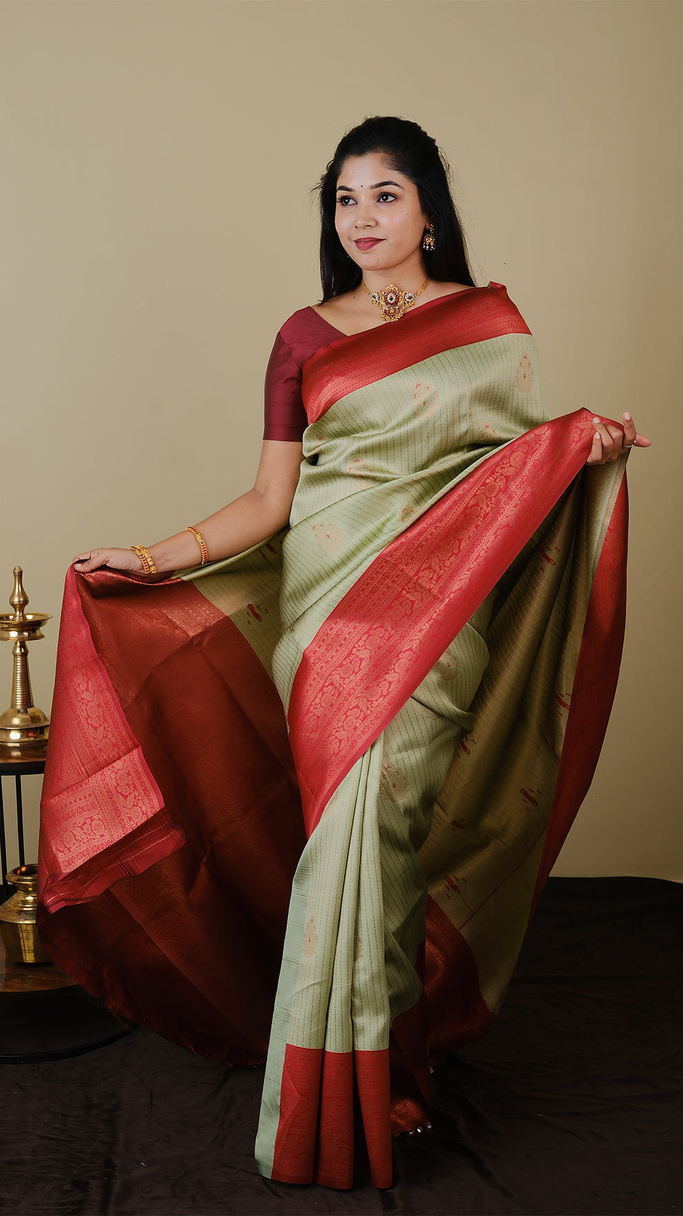 Soft silk brocade in pistha green with vairaoosi and gold motif body and chilli red contrast pallu with double zari border - AVANTHIKA (20009007)