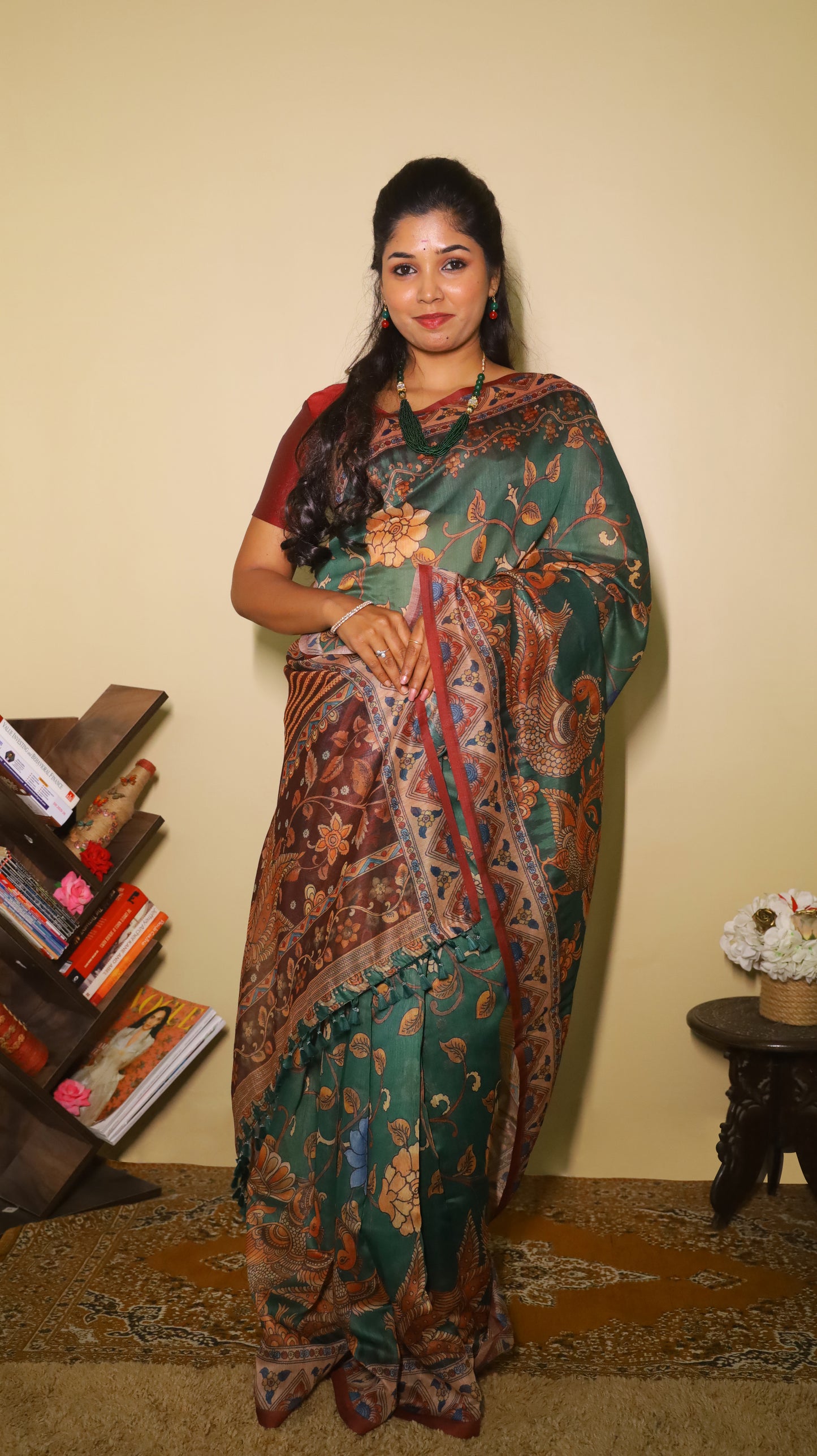 Exquisite deep bottle green silk cotton saree with floral and peacock motifs, paired with a maroon border - VEDHIKA