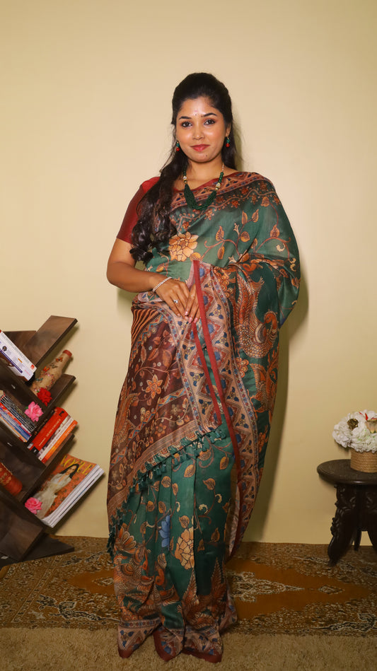 Exquisite deep bottle green silk cotton saree with floral and peacock motifs, paired with a maroon border - VEDHIKA