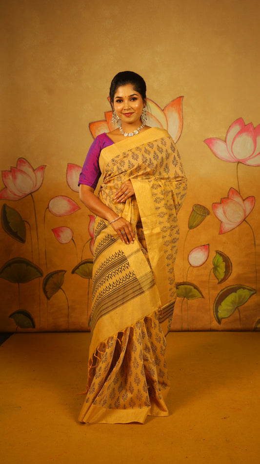 Handloom Cotton Saree in mud brown with all-over black Leaf block print Motifs and a subtle gold border - BOOMIKA