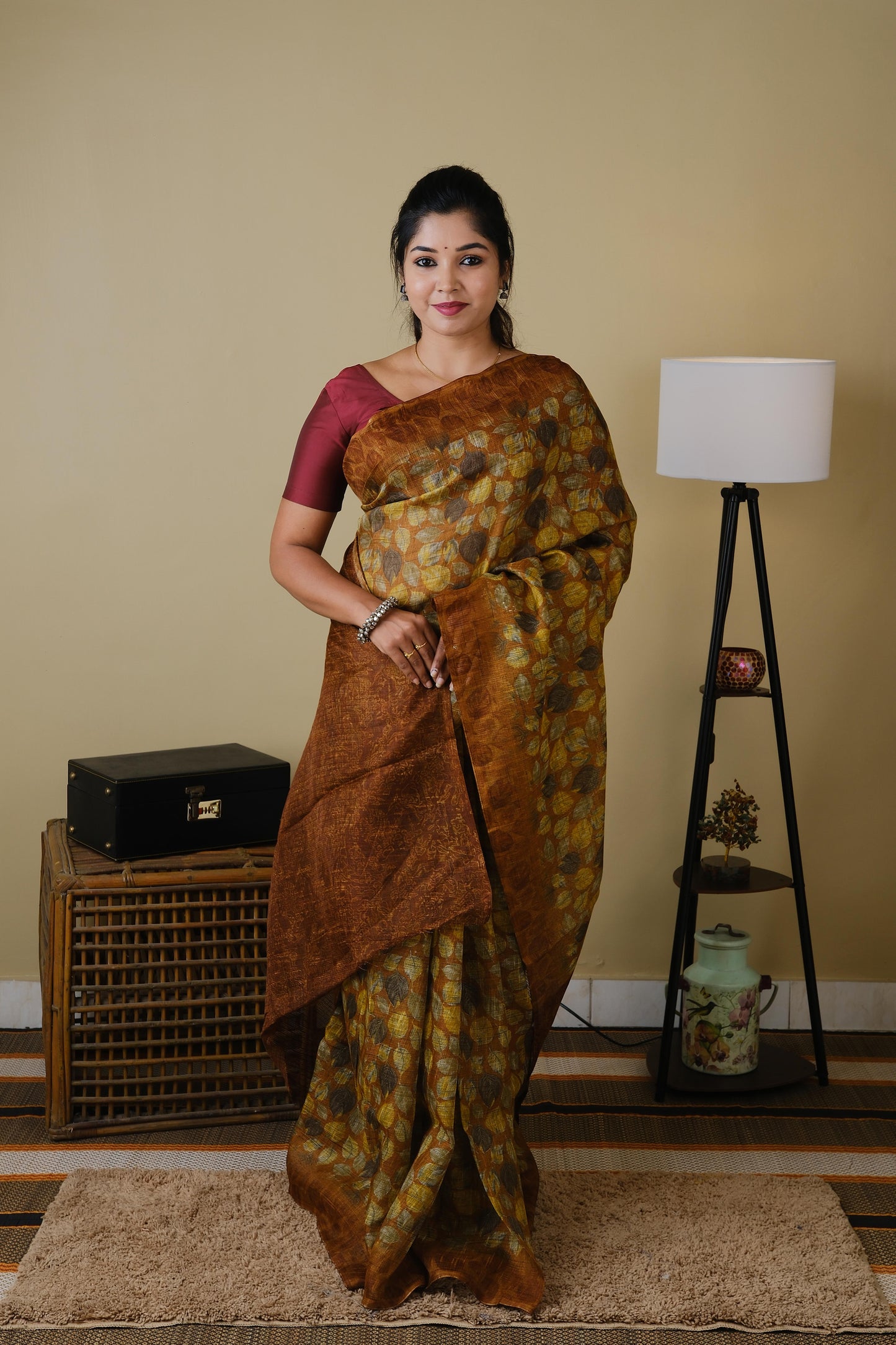 Jute cotton in brown with falling leaves pattern and brown border - BOOMIKA