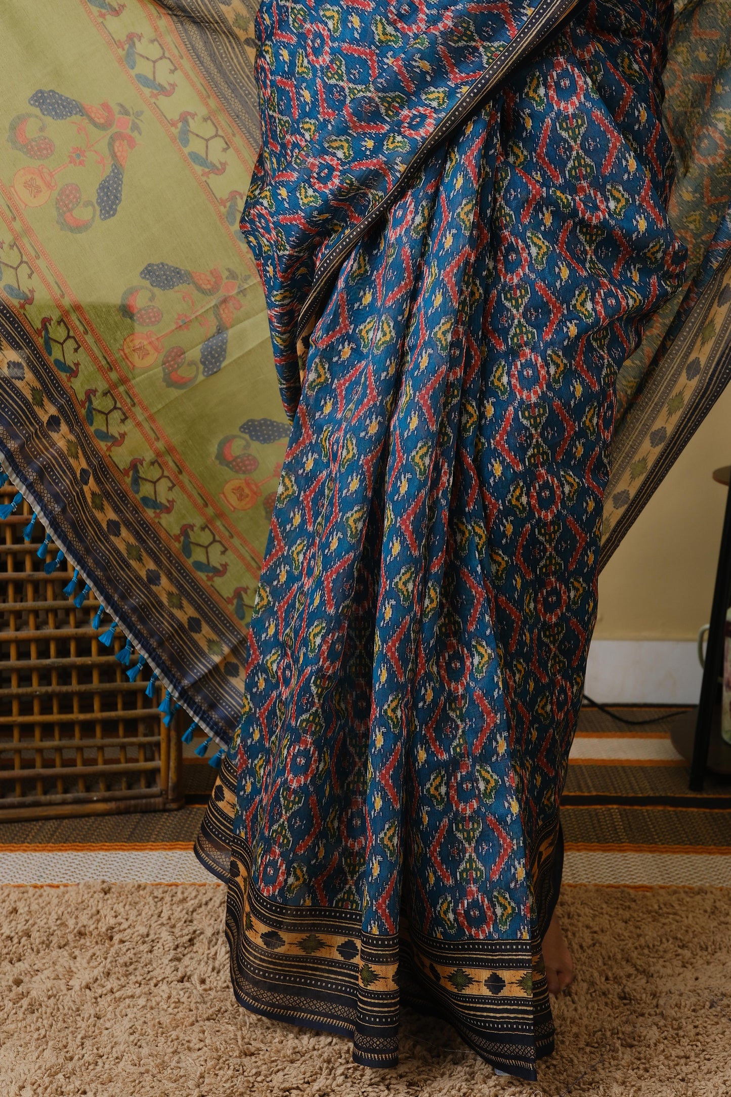 Soft cotton in teal green with patolla print and black border - BOOMIKA